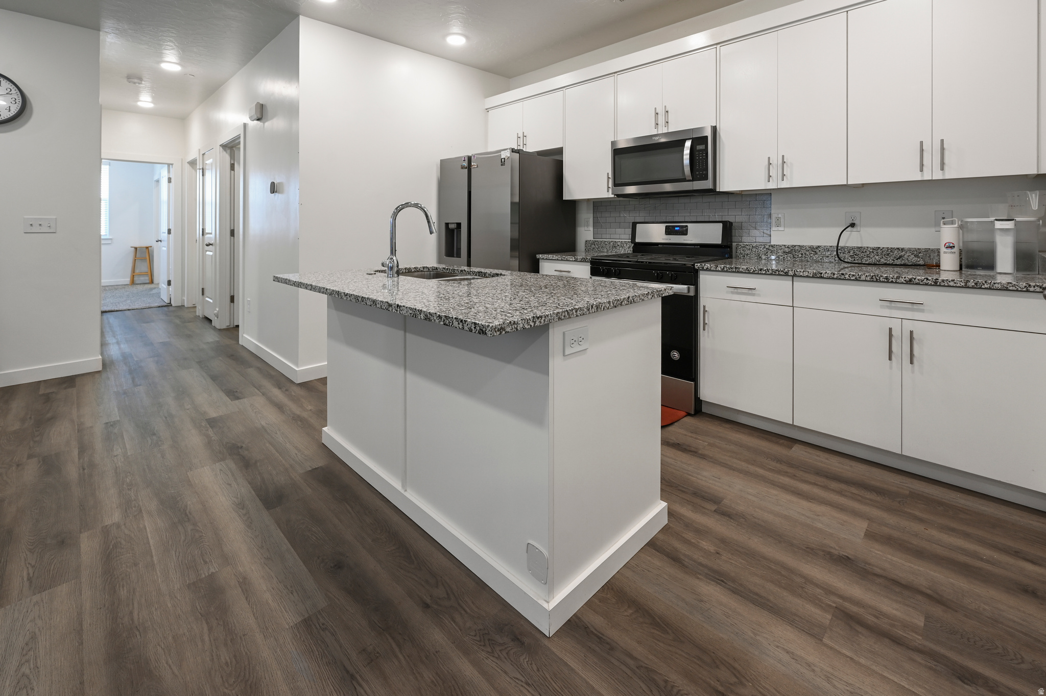 Welcome to Providence Gateway on the desirable south end of the valley, conveniently located near shopping, dining, and everyday amenities including Macey's and surrounding restaurants.  This 2-bedroom, 2-bathroom second-floor condo offers a comfortable layout with natural light throughout the main living areas. The floor plan provides easy flow between the kitchen, dining, and living spaces, making it functional for daily living and entertaining.  A standout feature of this home is the parking convenience, including a 1-car garage plus an additional dedicated parking space directly in front of the garage.  Community amenities include a pool, fitness/workout center, and clubhouse. The HOA includes trash and water services, helping simplify monthly maintenance responsibilities.  The seller is offering $5,000 in concessions toward buyer closing costs, rate buy-downs.