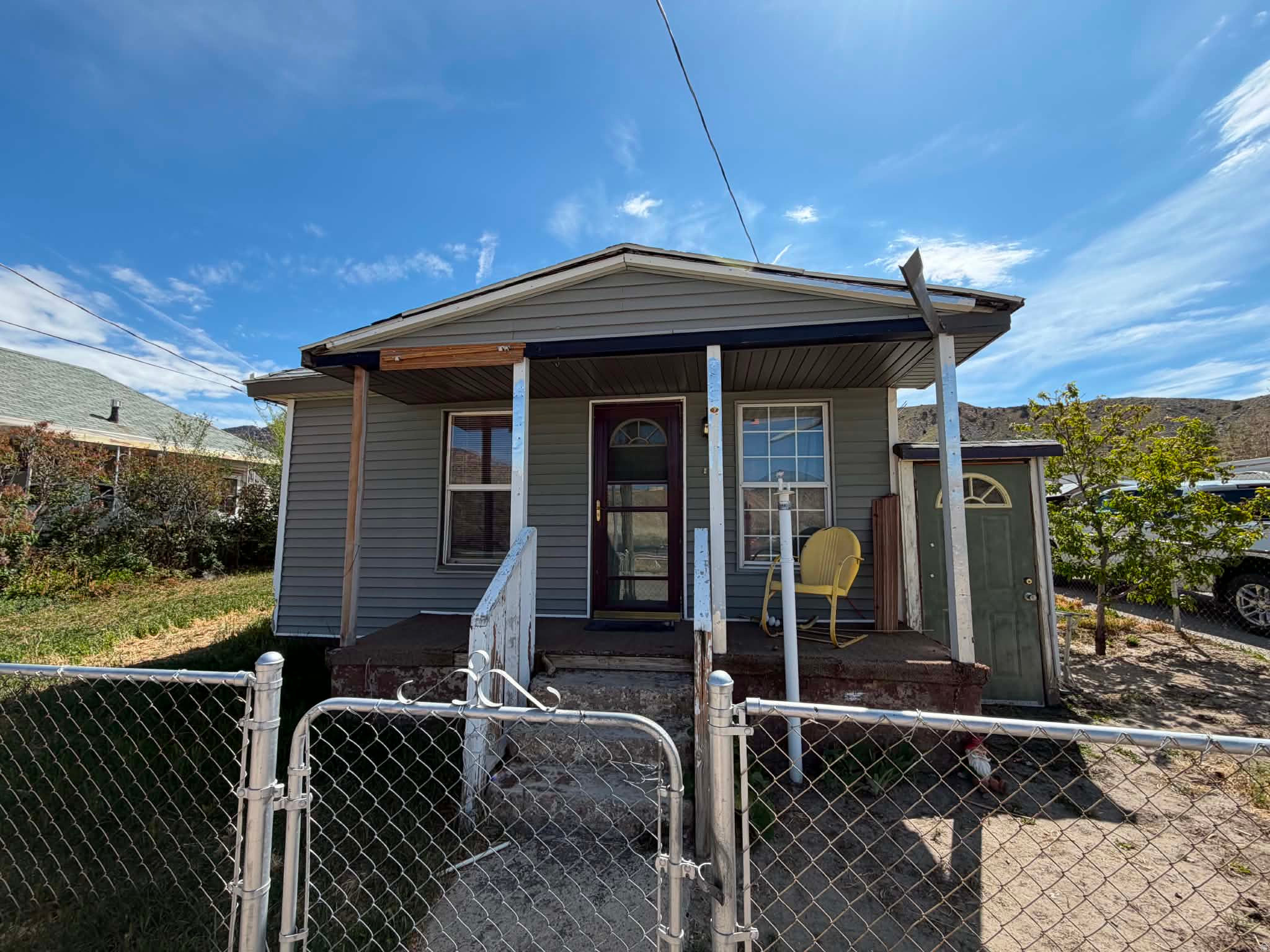 Charming bungalow cottage on a corner lot in Helper! This 2-bedroom, 1-bathroom home offers single-level living, a functional layout, a built-in dishwasher, disposal, a freestanding range/oven, a laundry area, and window evaporative cooling. Enjoy mountain views, mature trees, full landscaping, a fully fenced yard, shed storage, outdoor lighting, and uncovered parking. Conveniently located near schools and Helper amenities. Buyer to verify all information. Buyer is advised to obtain an independent measurement.