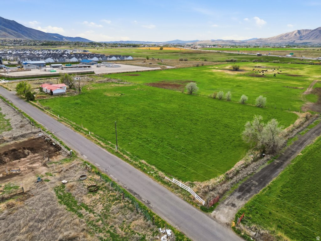 LOCATION! LOCATION! LOCATION!   A 4.63 acre, light industrial, parcel of land in South Utah County is ready to develop with utilities on the corner.  This parcel of Industrial zoned land is designated for light manufacturing, warehousing, distribution and similar low-impact industrial activities.   Owners have a pre-approved concept plan for storage unit development with Salem City.  This land has adequate water shares and a potential to be subdivided into 1.13-acre parcels.  With 3500 homes approved to be built in the near future, the first 600 feet of Beer Creek Blvd will begin this summer as part of Salem's Master Planned Road and finished as development moves through.   Don't miss this rare opportunity to invest in one of Utah County's fastest-growing corridors.