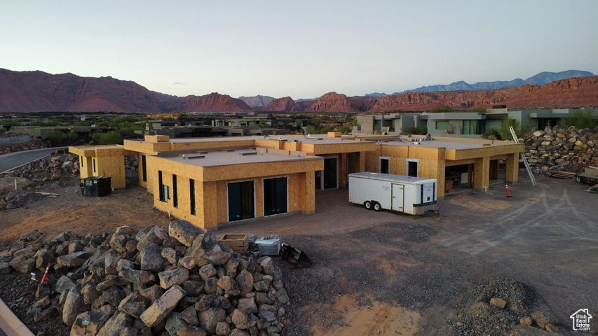 Experience the pinnacle of desert luxury in this stunning Split Rock custom 5,205 sq. ft. residence, perfectly positioned in the exclusive Entrada community. With dramatic Red Rock and Snow Canyon views as its backdrop, this home captures the essence of Southern Utah living. Offering 4 spacious bedrooms, 4 full baths, 2 half bathrooms and a 4-car garage, every detail has been crafted with sophistication and comfort in mind. The open-concept design flows seamlessly, with expansive windows framing the breathtaking scenery and filling the home with natural light. Step outside to your private resort-style retreat, where a sparkling pool, multiple lounge areas, and thoughtfully designed outdoor entertaining spaces invite both relaxation and celebration.  Whether hosting guests under the desert sky or savoring quiet moments surrounded by nature, this home offers an unparalleled lifestyle.  Blending architectural elegance with modern amenities, this Entrada estate is more than a home, it's a sanctuary of beauty, privacy, and timeless design.