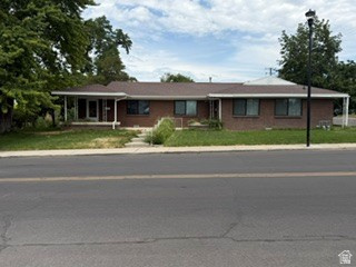 Centrally located on Main Street in Historic Sandy District.  This large two bedroom one bath duplex is historically zones and is sitting on a large lot.  Duplex has been completely renovated.  New Fiberglass black windows, complements the solid brick exterior.  New water heaters, LVP flooring, bathrooms and kitchens on both sides.  SS appliances, New main water and sewer line installed, New sprinkler system.  Boasting a full driveway.  One detached car garage for each side with additional parking.   Rents are locked in until spring of 2027, $1700, $1785.  Located just minutes from several retail and entertainment areas.
