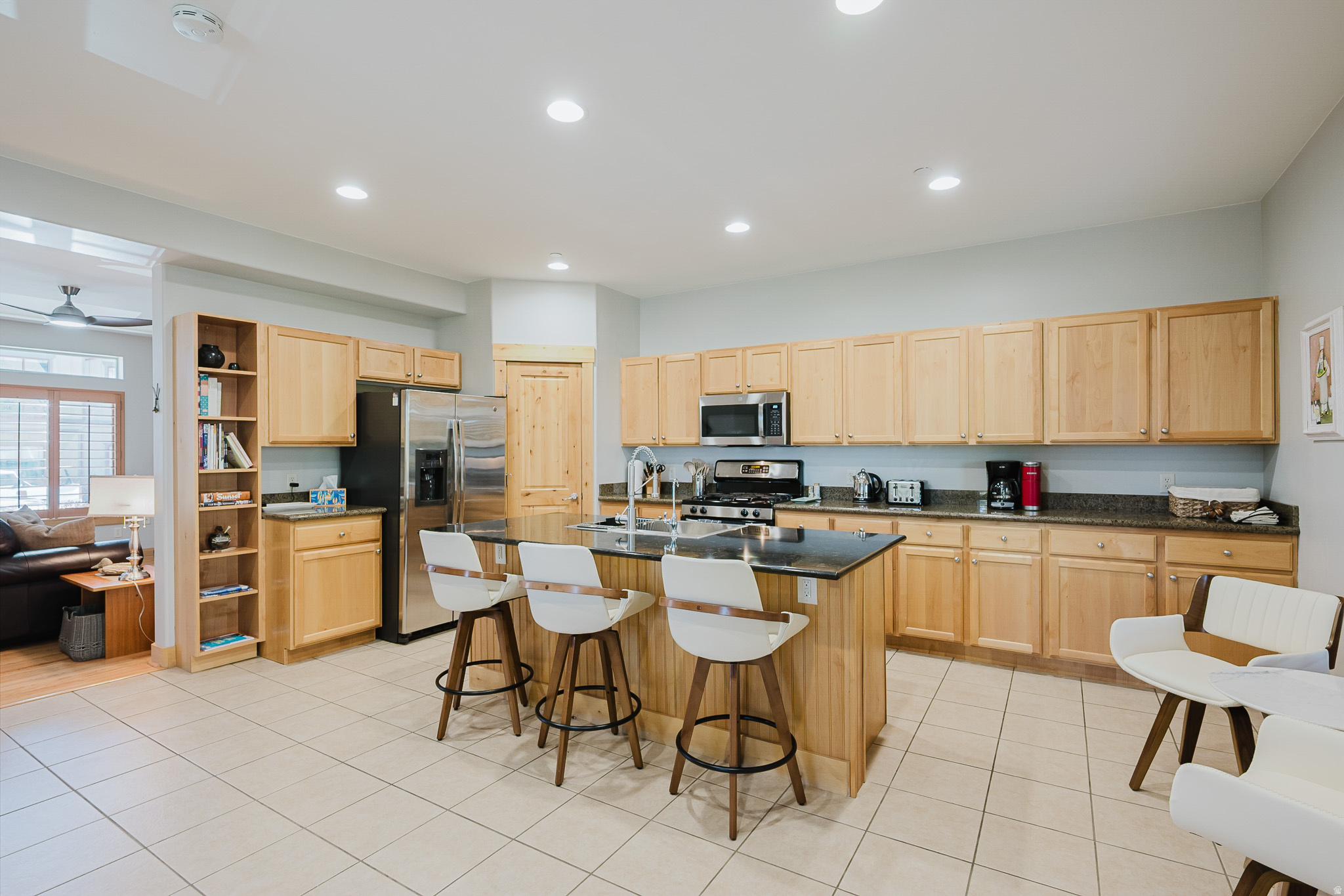 Located in the highly desirable Bear Hollow Village, this bright, fully furnished 4-bedroom, 3.5-bathroom townhome offers true turnkey convenience. An end unit complete with a private hot tub and attached two-car garage, it is perfectly suited for effortless ''lock-and-leave'' mountain living--just minutes from Park City Mountain Resort's Canyons Village and a short drive to the restaurants, cafs, and shops of Kimball Junction. Tastefully updated and move-in ready, the home blends comfort and style with thoughtful upgrades throughout. Recent improvements include custom two-tone neutral interior paint, LED lighting, ceiling fans, new carpet, new toilets, and GE stainless steel appliances, along with a new microwave, Kraus oversized stainless sink, and new garbage disposal. The kitchen is finished with granite countertops, while the living area features a cozy gas fireplace. Step outside to your private deck and unwind in the 8-person Caldera spa. Added highlights include a newer roof and heat tape (2020), central A/C (2011) and an oversized two-car garage equipped with a Universal Tesla EV charger. As an end unit, the property offers added privacy, scenic views, and off-street parking for two additional vehicles. Low HOA dues add to the appeal. Ideal as a primary residence, second home, or investment property, this townhome location also boasts strong rental potential. Community amenities include a clubhouse, seasonal pool, year-round spa, fitness center, soccer field, half basketball court, putting green, fire pit, and BBQ area. Located just below the Olympic ski jumps and adjacent to Park City's public trail system, this home provides easy access to year-round outdoor recreation. Whether you are looking for a mountain getaway, income property, or full-time residence, this home offers the best of the Park City lifestyle. This property is being offered fully furnished, ready for your enjoyment or immediate rental Please note: HOA Fee: $227. Water: $30