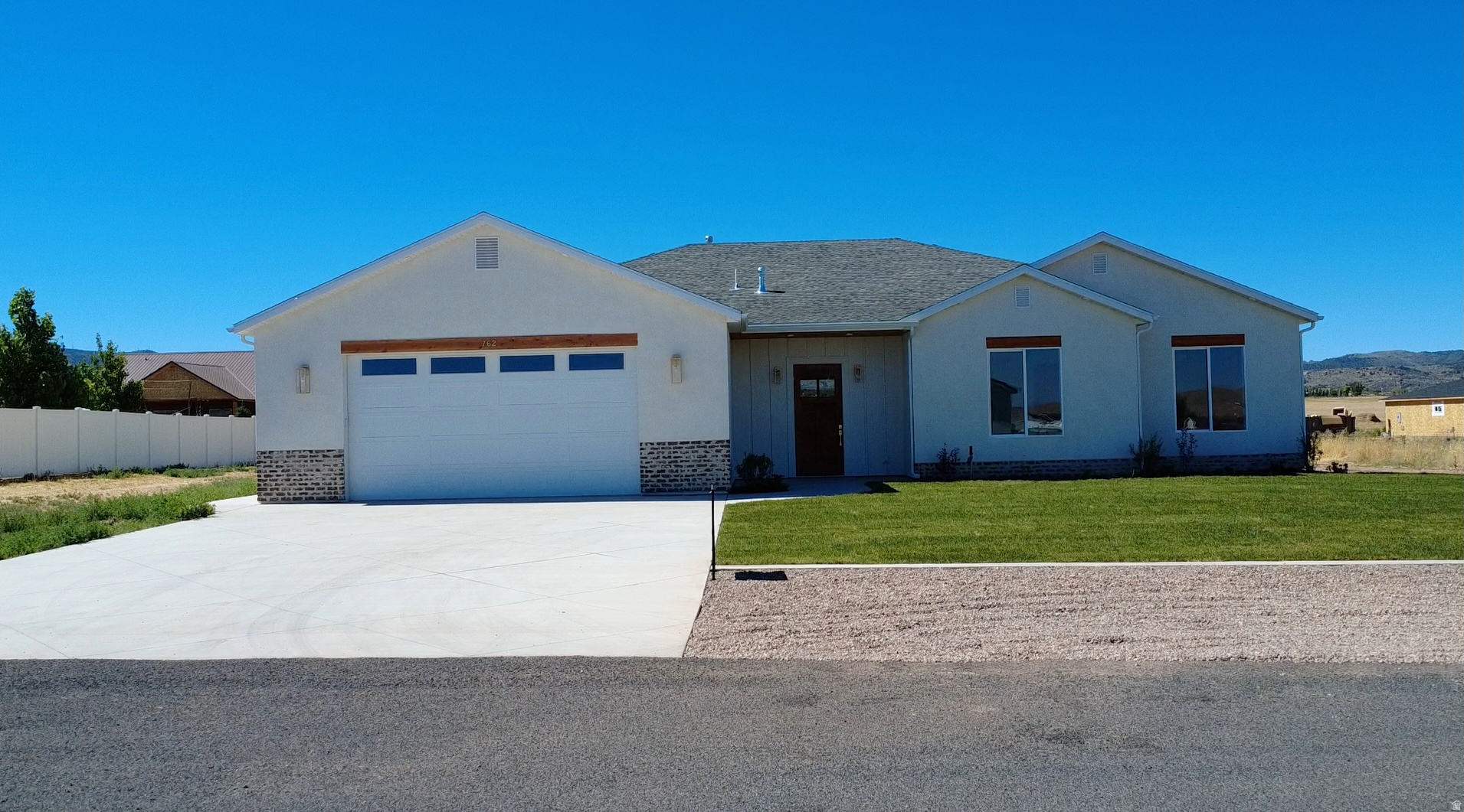 Brand new 2026 build in Enterprise! This 2,657 sq ft home offers 4 bedrooms, 3 full baths, and an oversized 2-car garage on a 0.50 acre lot. at the end of a cul-de-sac. No HOA. Designed with upgrades throughout: tall ceilings and doors, quartz countertops, custom cabinetry, large pantry, luxury laminate flooring, upgraded carpet/pad, and spray foam insulation for efficiency. The open living, dining, and kitchen area features an 8-burner ILVE gas range with electric oven, stunning hood, and a 6' side-by-side commercial-style fridge/freezer. Spacious primary suite with tiled shower and bath, plus a 2nd bedroom with private ensuite. Large laundry with sink, water softener, EV charger stub, shed/shop power stub, wired for sprinklers. Landscaping ready for your vision. 40 minutes to St. George or Cedar City.