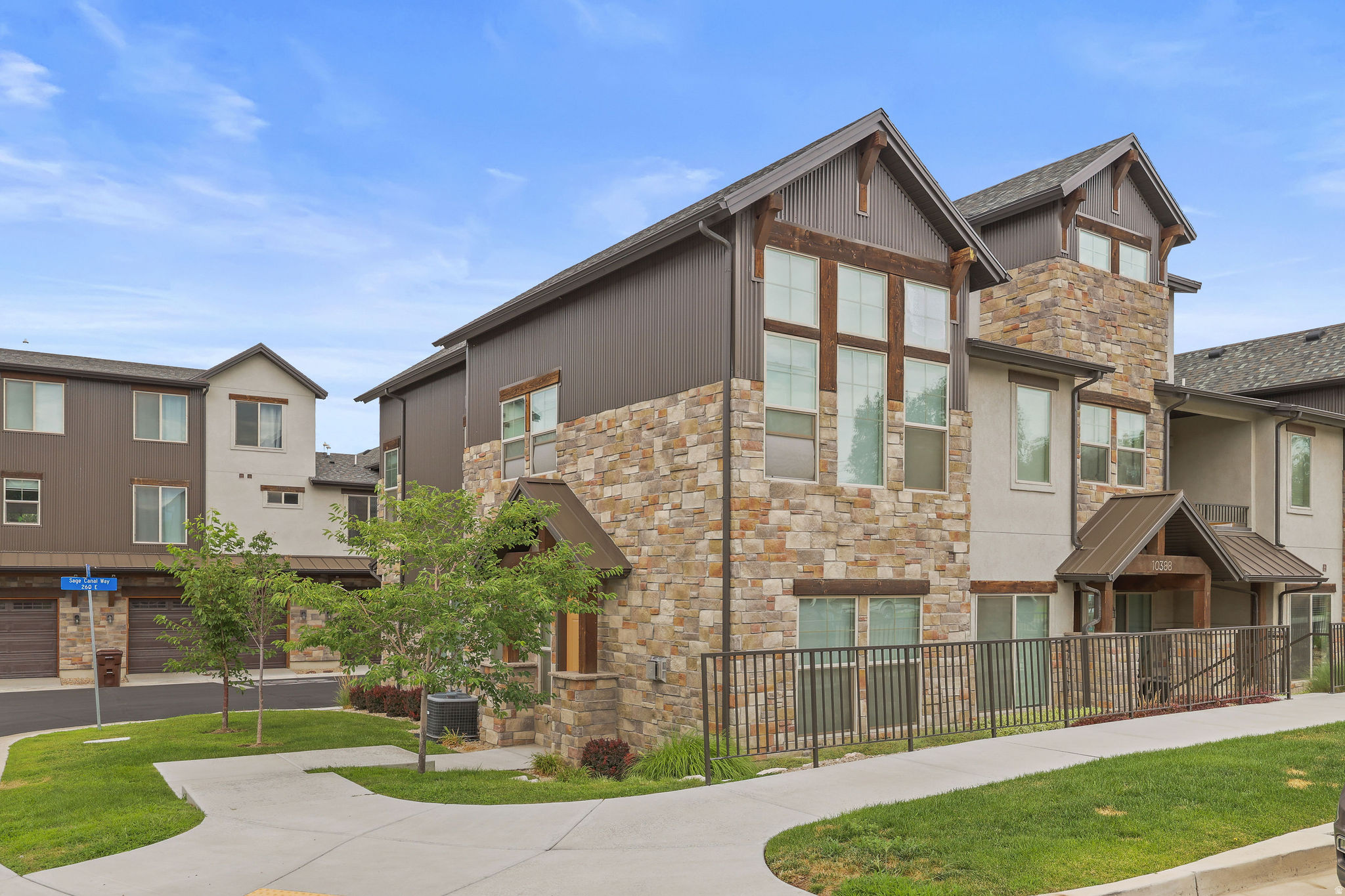 Welcome to luxury, convenience, and low-maintenance living in the highly sought-after Red Sage HOA in Sandy! This stunning 3-bedroom, 3-bathroom end-unit townhome shows like new and is loaded with premium upgrades that set it apart from the rest.  Step inside to discover an open, light-filled floor plan with soaring ceilings that create an incredible sense of space. The gourmet kitchen flows seamlessly into the living area, making it perfect for entertaining or relaxing at home. Enjoy the comfort of two beautiful fireplaces, including one in the spacious primary suite for a true retreat experience.  The luxurious primary bedroom also features a fully customized walk-in closet, while thoughtful upgrades throughout the home include automatic window shutters, a whole-home steam humidifier, soft water system, tankless water heater, and extensive built-in garage storage and 220 installed on both sides of the garage for EV charging that maximizes organization and functionality.  As an end unit, you'll appreciate the added privacy and abundance of natural light. Residents of Red Sage enjoy outstanding community amenities including a pool, clubhouse, and fully equipped fitness center, all while being conveniently located near shopping, restaurants, parks, schools, freeway access, world-class skiing, and everything Sandy has to offer.  This is a rare opportunity to own a move-in ready home with luxury finishes, modern efficiency, and exceptional community amenities. Come experience why this Red Sage townhome is the perfect place to call home!