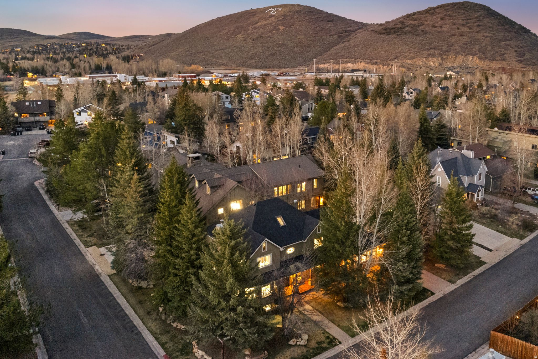 Own A Corner Of Prospector In Central Park City With 2 Homes & 1 Lot. This is the ultimate in-town property offering two homes and one lot with a garage. It's nestled in the quaint neighborhood of Prospector Village and is walking distance to the best Park City restaurants, trails and a bus stop for easy access to the slopes. Own two homes and one lot with a garage, perfect as a primary home, a rental or a deluxe vacation get away. The homes are zoned for vacation rentals and are in the perfect location for easy Park City living. The first home at 2240 Monarch Drive offers a grand living space with vaulted ceilings, a wood burning fireplace, dining space for more than 20 people and special features like solid wood doors, custom iron fixtures, four bedrooms each with private bathrooms, a beautiful den/office space, a large mud room and more. The second home at 2164 Ina Avenue offers six bedrooms plus a loft perfect for sleeping 10+ people. It also has three living spaces and room for the entire crew to enjoy the mountain lifestyle. The property also offers an amazing, over-sized hot tub that can hold up to 20 people and heated sidewalks and driveways. The compound is fenced and has a beautiful, private back yard. Enjoy the over-sized three-car garage  which could be added onto for an apartment for more living space if desired. This is the most unique, in-town property offering space, flexibility, and multiple homes.