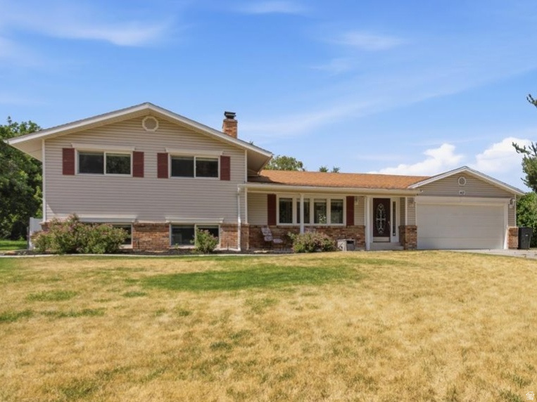 Prime East Bench Location  Just Steps from Weber State University! Location, charm, and opportunity come together in this beautifully updated East Bench home. Perfectly situated just steps from Weber State University, this property offers incredible potential for homeowners and investors alike. From the moment you arrive, you'll appreciate the inviting curb appeal with matching shutters, an east-facing covered front porch, and the perfect spot to enjoy your morning coffee while watching the sunrise. Inside, you'll immediately notice the fresh new carpet and paint, creating a bright, move-in-ready feel throughout. The welcoming family room features one of the home's three classic wood-burning brick fireplaces, adding warmth and character. The updated galley-style kitchen is both stylish and functional, showcasing granite countertops, white cabinetry, subway tile backsplash, and stainless steel appliances. Offering 4 bedrooms and 2 bathrooms, this home provides plenty of space for family and guests. The oversized basement family room includes a built-in desk area, making it ideal for a home office, study space, or recreation room. You'll also find a spacious laundry room and abundant storage. The refreshed bathrooms and kitchen feature today's sought-after finishes, while the separate basement entrance creates exciting possibilities for rental income, multigenerational living, or a flexible investment opportunity in this highly desirable university location. Step outside to enjoy the covered backyard patio overlooking a private, fully fenced yard. The corner lot offers additional outdoor space, enhanced privacy, and room to relax or entertain. Conveniently located near shopping, dining, entertainment, parks, and highly rated schools, this East Bench gem offers the perfect combination of location, comfort, and versatility. Don't miss your chance to own this exceptional home-schedule your private showing today!  Square footage figures are provided as a courtesy estimate only and were obtained from County and MLS data .  Buyer is advised to obtain an independent measurement.