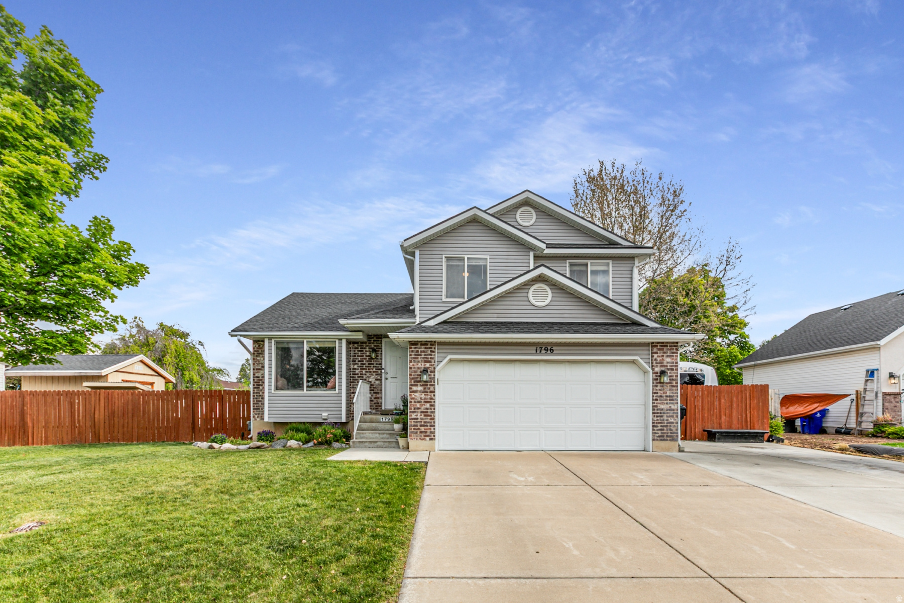 Motivated Sellers!! Huge price reduction!! Welcome home to comfort, convenience, and family-friendly living! This 4-bedroom, 3-bath home features a custom kitchen bar overlooking the living room, built-in storage, and an owners suite with a private bath and large walk-in closet. Recent updates include a new roof (2021) and furnace/A/C (2022). Enjoy a fully fenced yard with RV parking and secondary water. The shed, appliances, chicken coop, and trampoline are included.