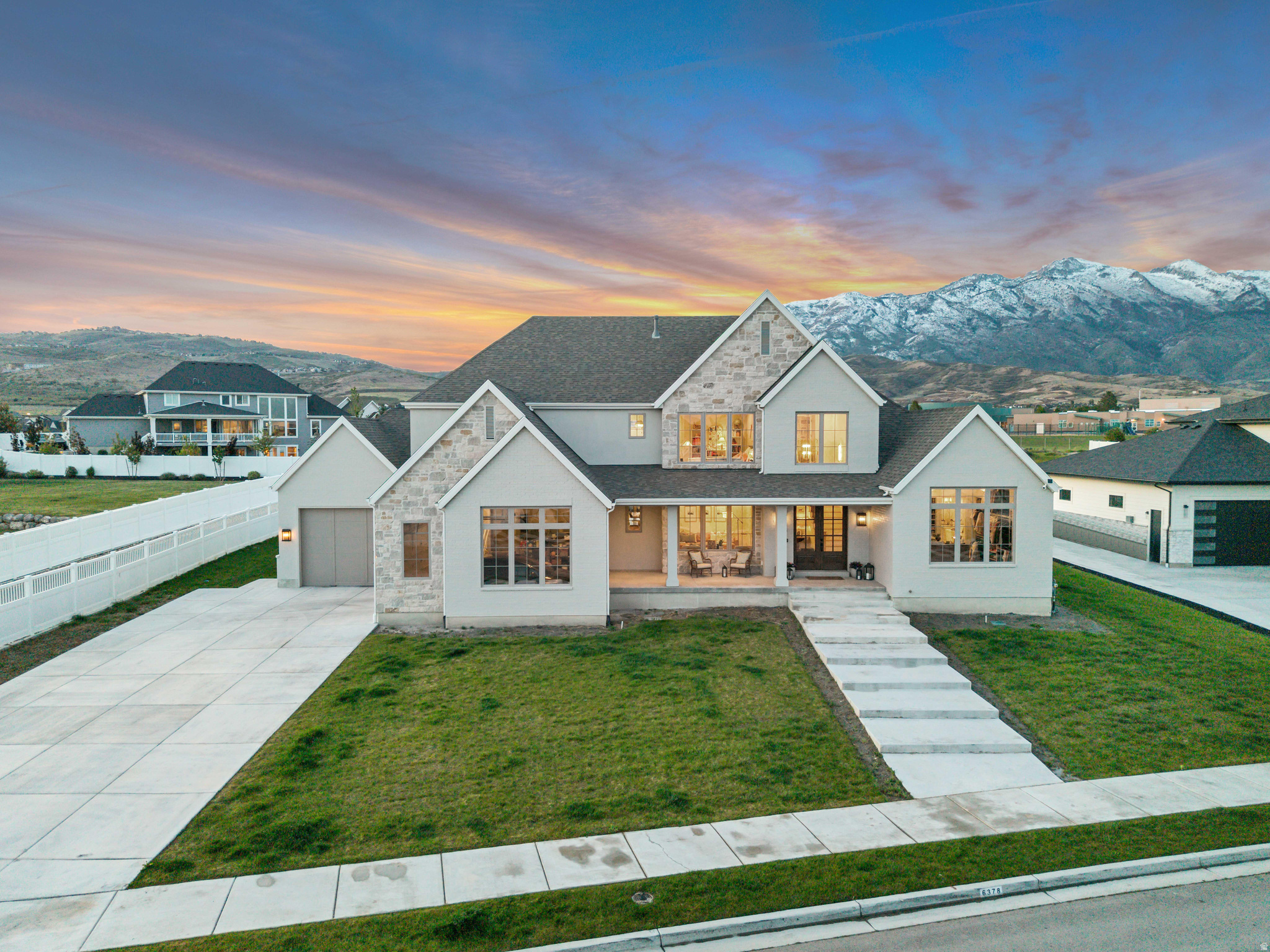 Located in the heart of Highland, walking distance to Ridgeline Elementary and quick access to trails and shopping. The moment you enter the home you're greeted with tall ceilings, massive windows, and mountain views that immediately capture your attention. Natural light pours through every space, giving the home an open, airy feel throughout. The home was designed with both everyday living and entertaining in mind, offering spacious gathering areas and hangout spaces on every level. The gourmet kitchen is truly a centerpiece of the home, fully equipped with premium Wolf appliances: 60" range w/ double griddle and double ovens, steam oven, side by side twin Subzero 30 refrigerator towers with pull out freezer drawers, double dishwashers, ice maker, extensive wrap-around pantry, high-end inset cabinetry, and a layout that blends functionality with an elevated luxury feel. The lighting throughout the home adds another layer of warmth and design, creating a clean, high-end atmosphere in every room. The oversized 3-car garage is complete with an EV charger setup, potential boat storage, adding convenience for modern living. The main-level primary suite offers direct access to the backyard, a beautifully finished bathroom with dual vanities, separate tub and shower, and an expansive closet complete with a center island and ample built-in storage. Upstairs features an additional laundry, a spacious secondary family room, and three additional bedrooms with ensuite bathrooms and walk-in closets. The fully finished lower level continues to expand the home's versatility with a dedicated office/craft room, home gym, full kitchen bar area, and large open gathering spaces perfect for entertaining, movie nights, or hosting guests. With a rare combination of quality finishes, functionality, mountain views, and a prime Highland location, this home delivers both luxury and comfort in one complete package.