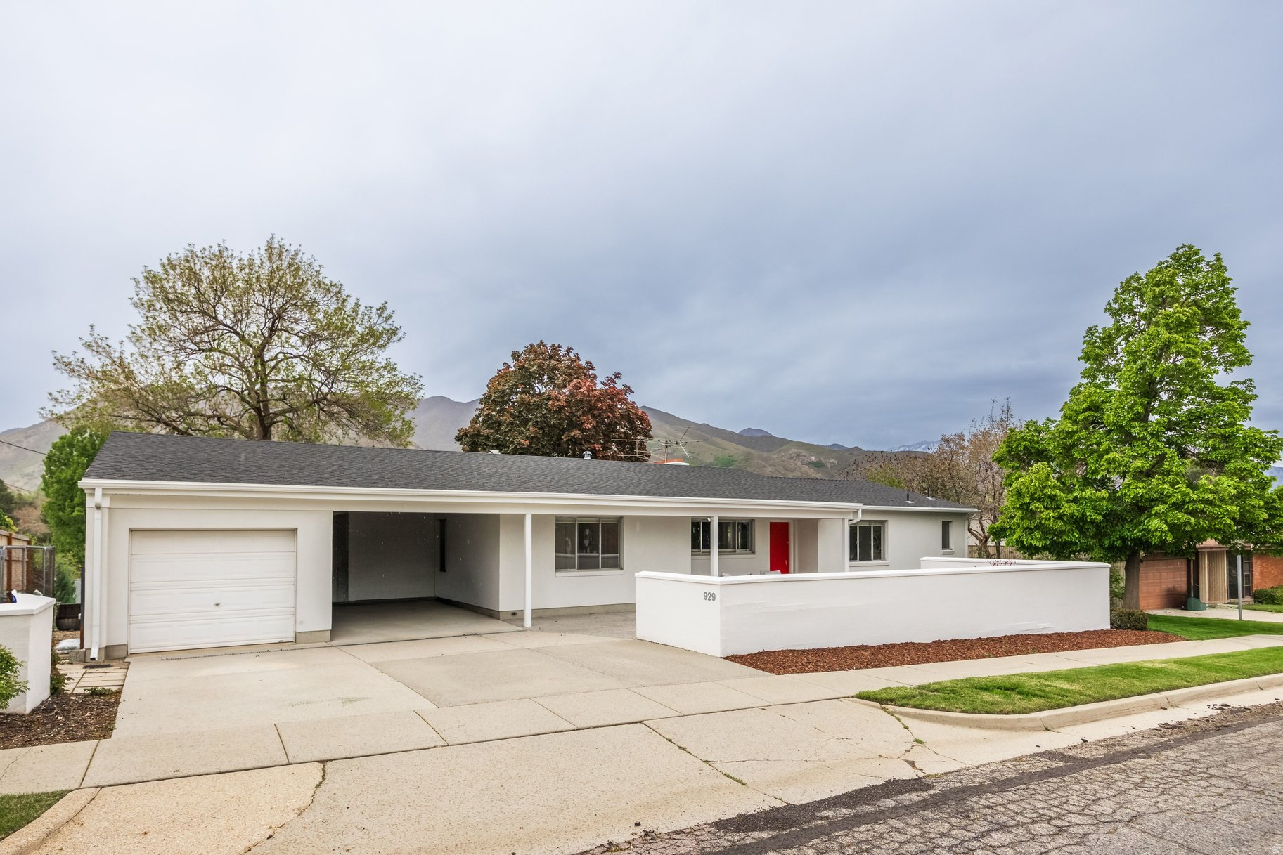 Elegant contemporary rambler in a highly sought-after neighborhood. Welcome to this beautifully updated home, ideally situated on a quiet cul-de-sac just minutes from the University of Utah, Research Park, Bonneville Golf Course, and downtown Salt Lake City. Enjoy breathtaking views of the Wasatch Mountains, perfectly framed to bring the outdoors in. This light-filled residence offers five bedrooms and three bathrooms with a thoughtfully designed open floor plan. The spacious kitchen features abundant storage and stylish updates, flowing seamlessly into inviting living areas ideal for both everyday living and entertaining. The primary suite provides a private retreat, while two fireplaces add warmth and character throughout the home. Step outside to a generous yard and a charming front porch that creates a welcoming first impression. With its ideal location, modern updates, and serene setting, this home offers the perfect blend of comfort, convenience, and natural beauty.