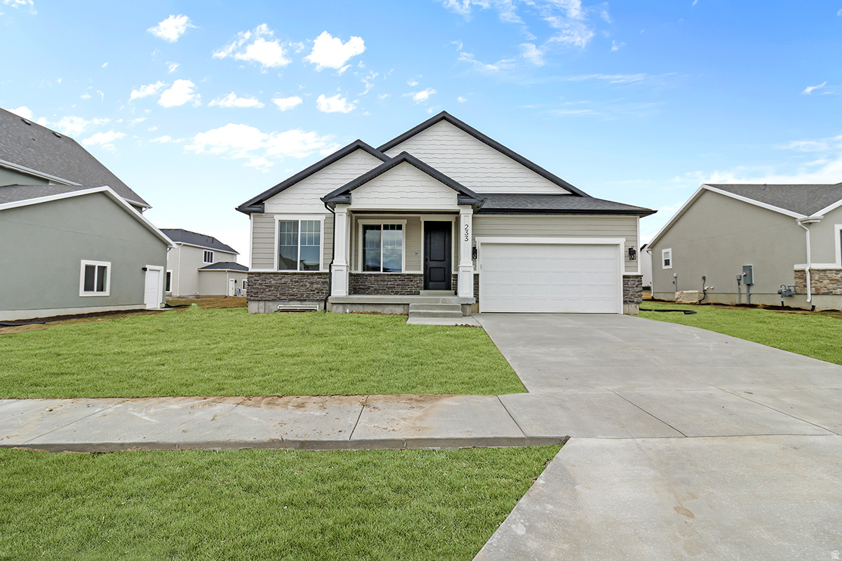 *** Front yard landscaping included. A traditional home with a modern layout perfect for you and your family, The Lyndhurst is easy to call home. With 3 beds and 2 baths, an open-concept main living space. Enter in to find a charming front living room to greet you in and take a few steps into a hallway towards the bedrooms and bath. A spacious family room opens to the kitchen and the dining features large windows for plenty of natural light into your home. A large walk-in pantry and island in the kitchen provide you with the perfect space for prepping and cooking for family meals spent together at the dining table. Find the owner's suite near the great room with a spacious owner's bath and walk-in closet, which you'll enjoy most. The unfinished basement provides the potential for an additional 4 bedrooms, a bath, storage space, and a family room for turning into anything from a lounge space or children's playroom. ***Under construction. Estimated completion date is mid August. ***Pictures are of a different house and show different finishes and features. Selections sheets for this home are included for reference.