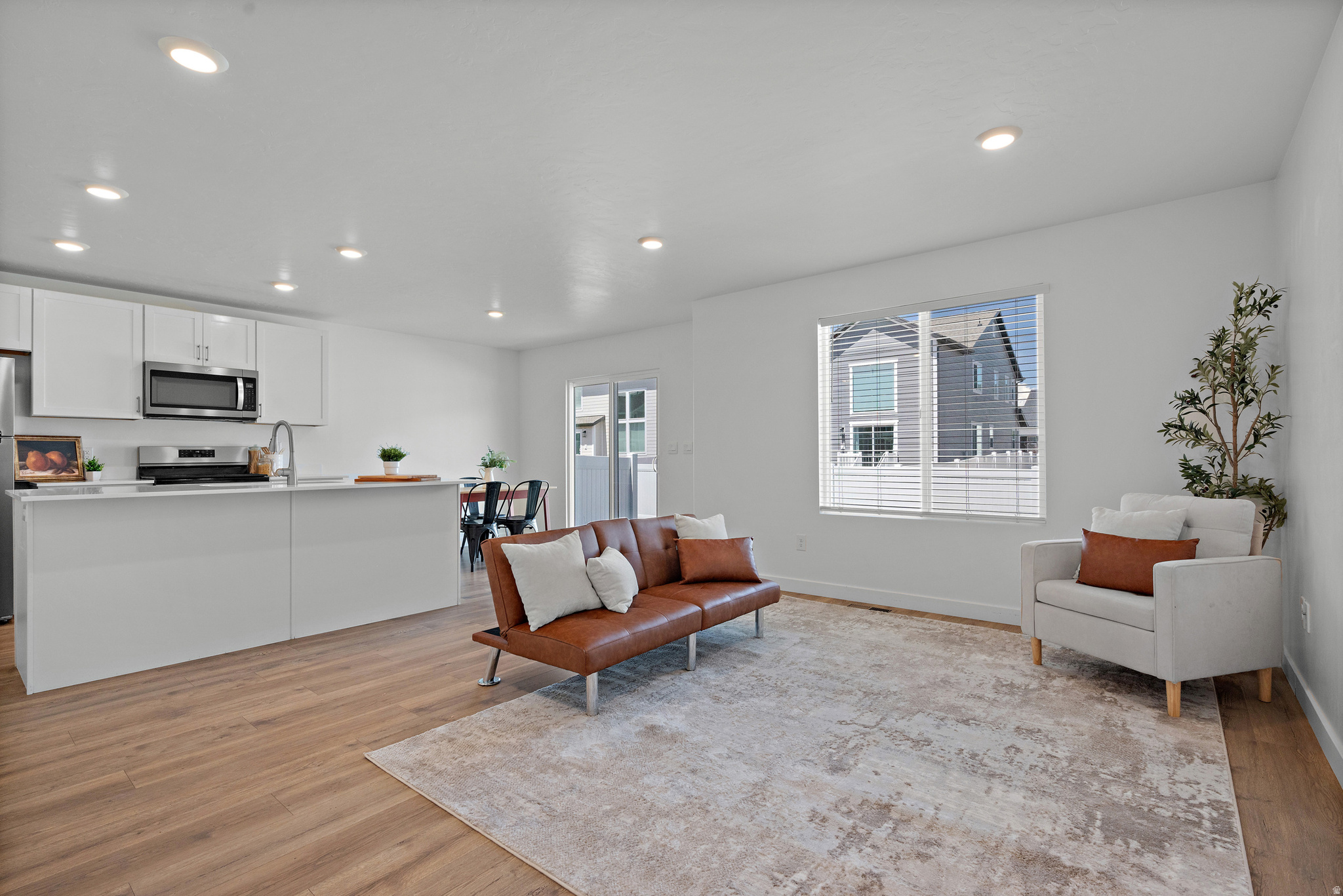 Light-filled end-unit townhome with room to grow in an unbeatable Lehi location! This 3 bed, 2.5 bath home features an open-concept layout, abundant natural light, and added privacy as an end unit. The unfinished basement offers incredible potential for future expansion. Enjoy low-maintenance living with community amenities including a pool and clubhouse, all just minutes from Silicon Slopes, shopping, restaurants, and commuter access.
