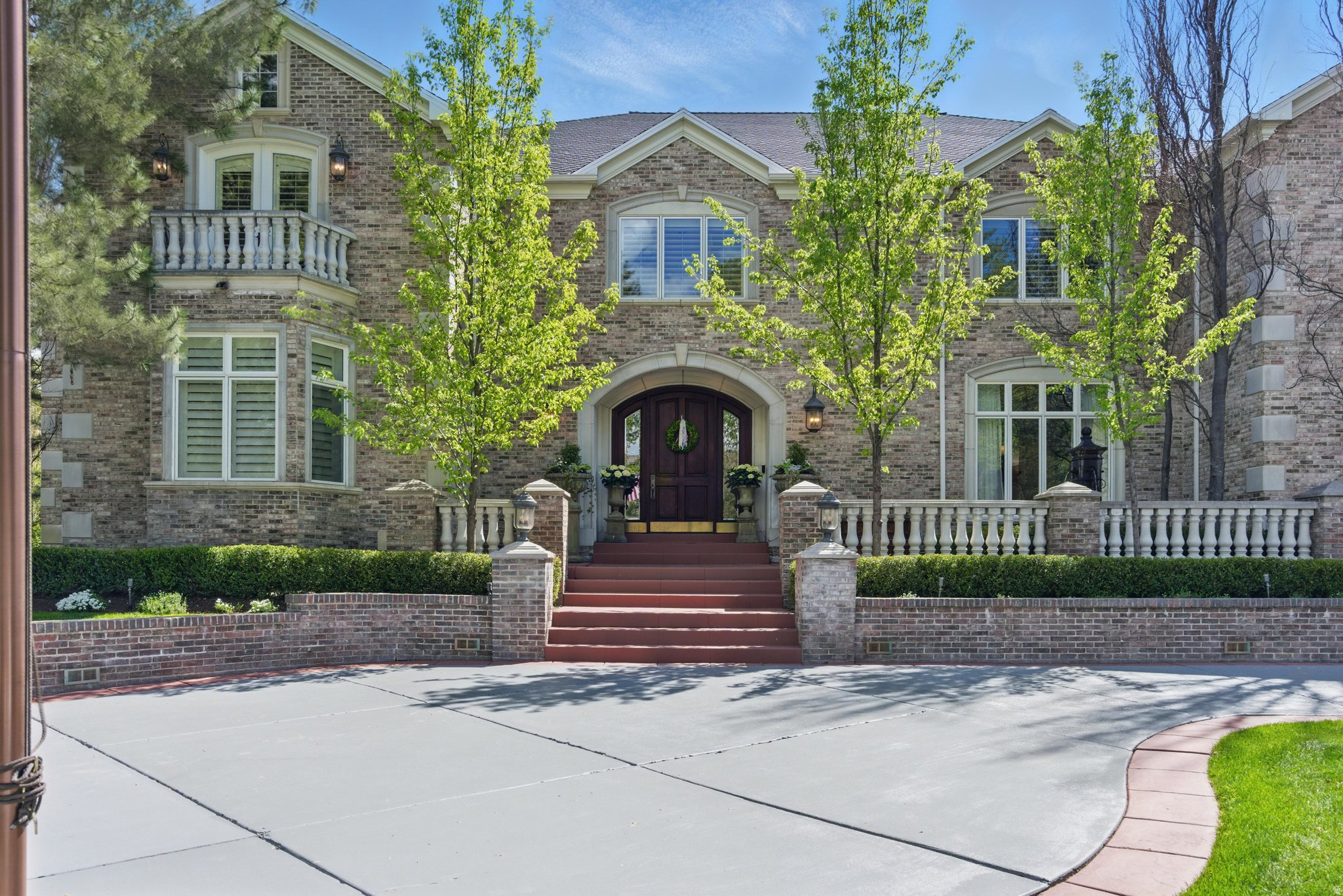 Don't miss this one-of-a-kind chance to own a top home in the gated Roselan community in beautiful, tree-filled Holladay. It's like living in your own private park, with easy access to everything, quick commutes, and total privacy. This custom-built estate has a huge, smart layout with high-end details and expert craftsmanship everywhere. The chef's kitchen shines with Thermador, Miele, and Sub-Zero stainless-steel appliances, granite counters, and custom cabinets. Tall, vaulted ceilings and tons of natural light make it feel open and bright. On the main floor: two home offices, a luxurious primary bedroom with its own deck and hot tub, a spa-like bathroom, and a massive walk-in closet with laundry. Great for parties-a 24-seat theater with a fun 1950s diner vibe, full gym, craft room, and a separate 2-bedroom apartment above the garage with its own kitchen, bath, and entrance. Outside: a big, covered patio with fireplace flows right from the family room for easy indoor-outdoor living. Enjoy a full outdoor kitchen, large pool with diving board, stone hot tub, and plenty of yard space. The heated 6-car garage has epoxy floors and water hookups. Downstairs: a full indoor spa with sauna and steam room, plus a wet bar/dance area, huge dry storage, and food storage rooms. Close to Cottonwood Canyons for world-class skiing and hiking, and just minutes from shopping, restaurants, and excellent schools. This is true luxury in one of Holladay's most desirable neighborhoods.