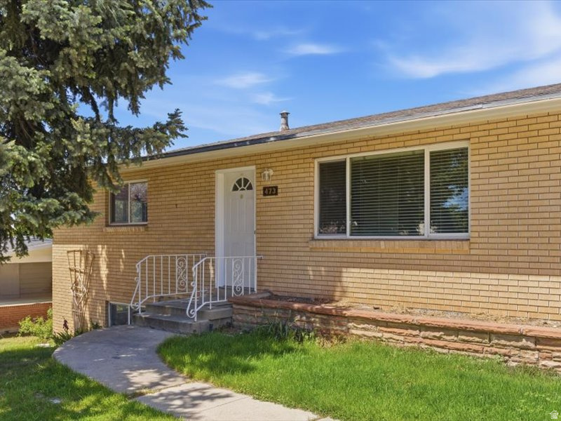Paint so fresh we don't have new pictures yet! Updated and move-in ready with fresh two-tone paint, new carpet, padding, and hardware. Enjoy lake views, stunning sunsets, a separate basement entrance, RV parking, covered patio, spacious garage with workbench, and a large backyard with room to grow.