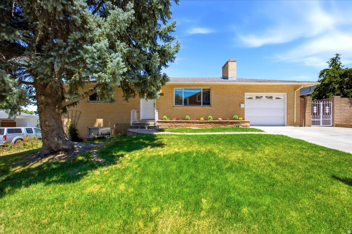 UPDATED Bountiful rambler - Move-in ready and priced right! Fresh NEW two-tone paint (Agreeable Gray + Pure White), brand NEW carpet, NEW padding, and NEW hardware throughout. Large Bedrooms, 2 Large Family Rooms, Large Washroom and storage.  Great Salt Lake views and stunning sunsets from the covered patio. Extra width driveway and an extra-deep garage with workbench, separate basement entrance, and a large backyard with room to grow.