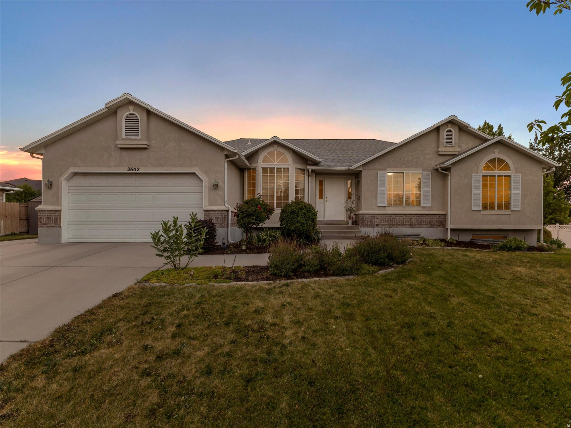 Multiple Offer Received. Highest and best offers due by 7/9/26 at 10:00 AM. Discover the incredible potential of this spacious rambler situated on a large 0.34-acre lot in a desirable, established neighborhood known for its quiet streets, convenient location, and welcoming atmosphere. Offering quality craftsmanship, an exceptional floor plan, and major system updates already completed, this home is ready for its next chapter. Recent improvements in 2025 include a new roof with ridge vents and a new HVAC system providing peace of mind for years to come. Inside, soaring vaulted ceilings and large windows create a bright and inviting living space. New carpet, fresh paint, a new kitchen faucet, and newer microwave and dishwasher enhance the home's appeal. The well-designed open-concept kitchen offers abundant cabinetry, a large pantry, a center island, and a corner window, creating an ideal space for everyday living and entertaining family and friends. The main level features four generously sized bedrooms, including a spacious primary suite with a charming bay window, ceiling fan, and walk-in closet. The spa-like primary bathroom features a corner soaking tub, separate shower, and private water closet. The expansive basement provides exceptional flexibility with two additional bedrooms and one full bathroom. There is also a rec room featuring a bar area that already has cabinetry, a countertop, a microwave, a refrigerator, and plumbing to easily add a sink making it a great spot for a second kitchen. The basement also offers a large storage room and unfinished space, allowing you to add additional bedrooms, create a private guest suite, establish a multi-generational living arrangement, or design an office, exercise room, or flex space to fit your needs. Outside, you'll appreciate the oversized backyard designed for both recreation and relaxation. Enjoy summer barbecues on the patio, shoot hoops on your own basketball court, harvest apples and grapes, or take advantage of the storage sheds and RV parking for all your vehicles, toys, and outdoor equipment. Secondary irrigation water helps keep the lush landscaping beautiful while reducing watering costs. Central air conditioning, a soft water system, abundant storage throughout the home, and included appliances add even more value. Ideally located near excellent schools, parks, recreation trails, shopping, restaurants, and everyday conveniences, this home offers an outstanding lifestyle with easy access to everything you need. Whether you're commuting, exploring nearby outdoor recreation, or enjoying local dining and entertainment, you'll appreciate the balance of peaceful neighborhood living and exceptional convenience. With its generous square footage, versatile layout, extensive storage, major mechanical updates, and endless possibilities for future customization, this is a rare opportunity to own a well-built home with the space and flexibility to grow for years to come.