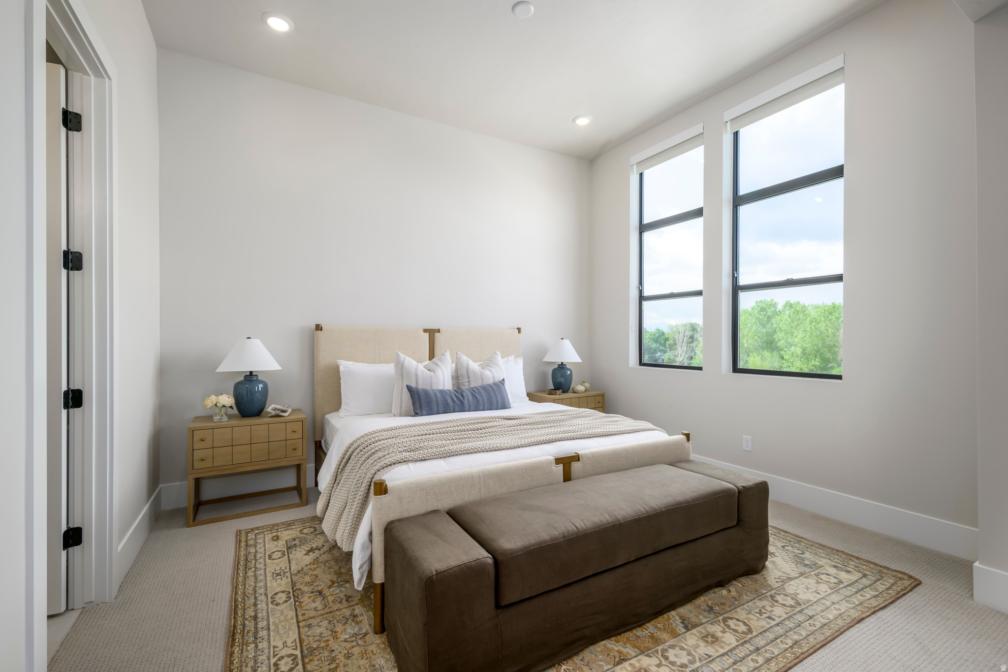 Step into a residence where light, volume, and elegance converge. From the moment you enter, soaring ceilings and dramatic windows create an immediate sense of openness that feels both grand and intimate. The entry-level en-suite bedroom provides a refined space for guests, a private office, or multigenerational living. The heart of the home unfolds on the main level - a seamless open-concept design anchored by a gourmet kitchen, flowing effortlessly into the sunlit great room and covered outdoor living. Upstairs, the primary suite is a true retreat with 11.5-foot ceilings, expansive windows, dual vanities, and a spainspired bath. A secondary en-suite bedroom and versatile loft complete the upper level. This to be built home is ready to be personalized at our design center. Crafted by Tri Pointe Homes, this brownstone is part of Aspire at Holladay Hills in Holladay - a walkable village community offering boutique shopping, curated dining, and inspired gathering spaces, all set against breathtaking Mount Olympus views and minutes from world-class recreation. Square footage figures are provided as a courtesy estimate only and were obtained from Builder. Buyer is advised to obtain an independent measurement.