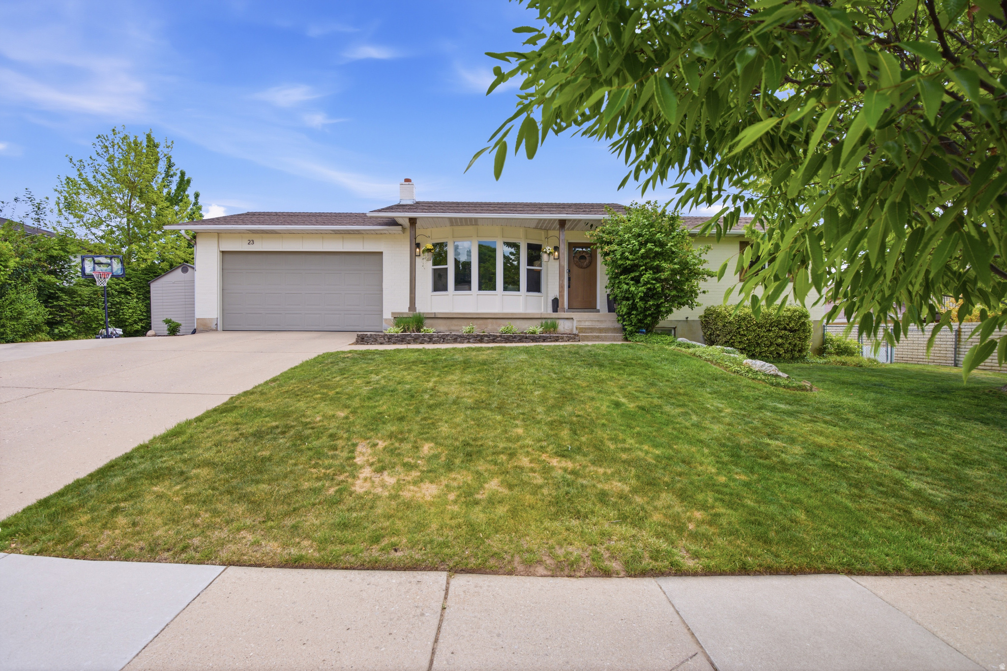 Welcome to 23 W Park Dr in the heart of Kaysville - a thoughtfully updated 5-bedroom, 3-bath home that perfectly blends comfort, functionality, and charm. Situated in a quiet, established neighborhood, this home offers inviting living spaces with tasteful modern updates throughout.  The bright and functional layout features spacious gathering areas and an updated kitchen create ideal everyday living and entertaining. The fully finished basement provides additional living space perfect for a family room, game room, home office, or guest retreat.  Step outside to enjoy the fully fenced backyard with mature landscaping, ideal for summer gatherings, relaxing evenings, and outdoor play. With RV parking, a 2-car garage, and ample storage throughout, this home offers both convenience and versatility.  Located just minutes from parks, schools, shopping, dining, and easy freeway access, this move-in ready home combines small-town charm with everyday convenience. A rare opportunity to own a beautifully maintained and thoughtfully updated home in one of Kaysville's most desirable neighborhoods.