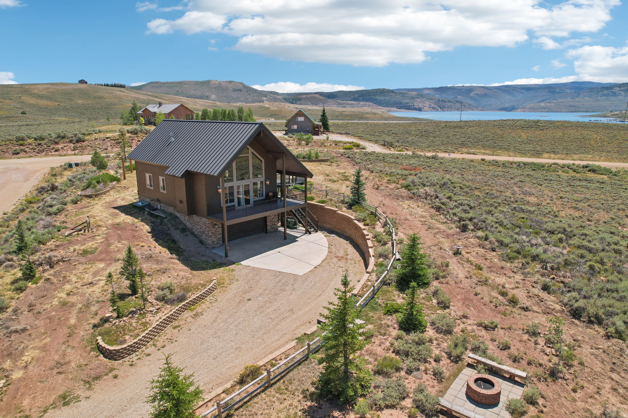 Located less than an hour and a half from Salt Lake City and less than 5 minutes from the Soldier Creek Marina, this is the perfect retreat to enjoy everything that nature has to offer. Whether you prefer fishing on Strawberry Reservoir or riding the trails on your ATV or snowmobile this is the ultimate location to enjoy the great outdoors. Featuring two master bedrooms and a loft that sleeps ten, this property is designed for both relaxation and entertainment. The main floor boasts an expansive area ideal for gatherings, with stunning 20 ft. high windows that offer breathtaking views of the surrounding landscape. The large kitchen has two dishwashers and ensures you have ample space to prepare and enjoy meals with ease. Outdoors, the spacious lot provides ample recreational opportunities with a large patio, tether ball court, and two fire pits. Enjoy winter activities such as snowmobiling with convenient access or take a brisk ten-minute walk to experience excellent fishing. Nestled near Strawberry Reservoir, this home offers the ultimate combination of serene natural beauty and modern amenities, making it a haven for those looking to unwind and connect with nature. Located in the gated Strawberry Lakeview community you will have privacy and security.