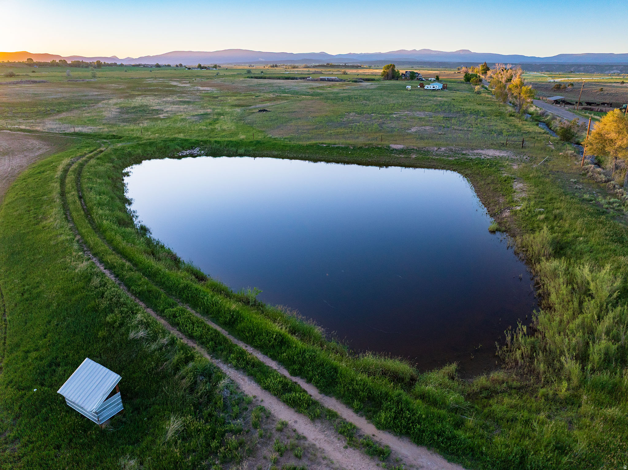 ALTAMONT, UTAH!  IN THE FOOTHILLS OF THE UINTAH MOUNTAINS!  AT THE FORK IN THE ROAD TO BLUEBELL!!  GREAT LOCATION!!  40 acres!  40 shares deeded BIA water! And the beautiful pond!  So may possibilities in this location!  City water to the farm house. 1 pivot, plus some hand line. Culinary water and power available for whatever you choose to use it for!  Roads are paved and county snow plows run all winter! A high demand, low supply area, come see it today!