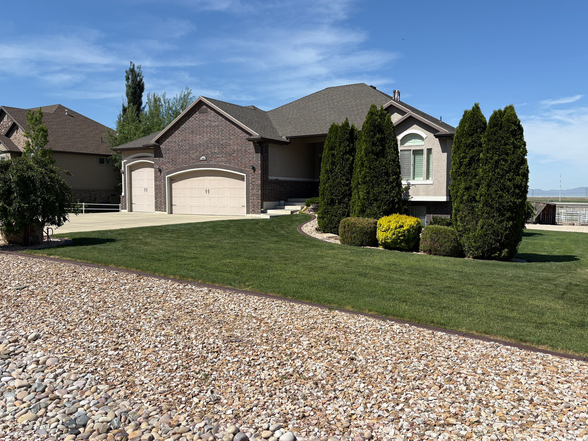 PRICE IMPROVED!!  SPECIALIZED HORSE PROPERTY!  Absolutely immaculate and impeccably maintained original-owner home on 1.45 acres with breathtaking views! HORSE READY with a 60' round pen, powered outbuildings, and a pull-around gravel drive designed for easy access with trailers, RVs, and equipment. This stunning home features an open, spacious vaulted floor plan filled with natural light. The bayed kitchen dining area walks out onto a large covered deck with sweeping views of the surrounding mountains, valley, and open land - the perfect place to relax and take in the peaceful setting. Walk-out basement provides additional living and entertaining space. Garage includes a heater and utility sink. Pride of ownership shines throughout this incredible property!