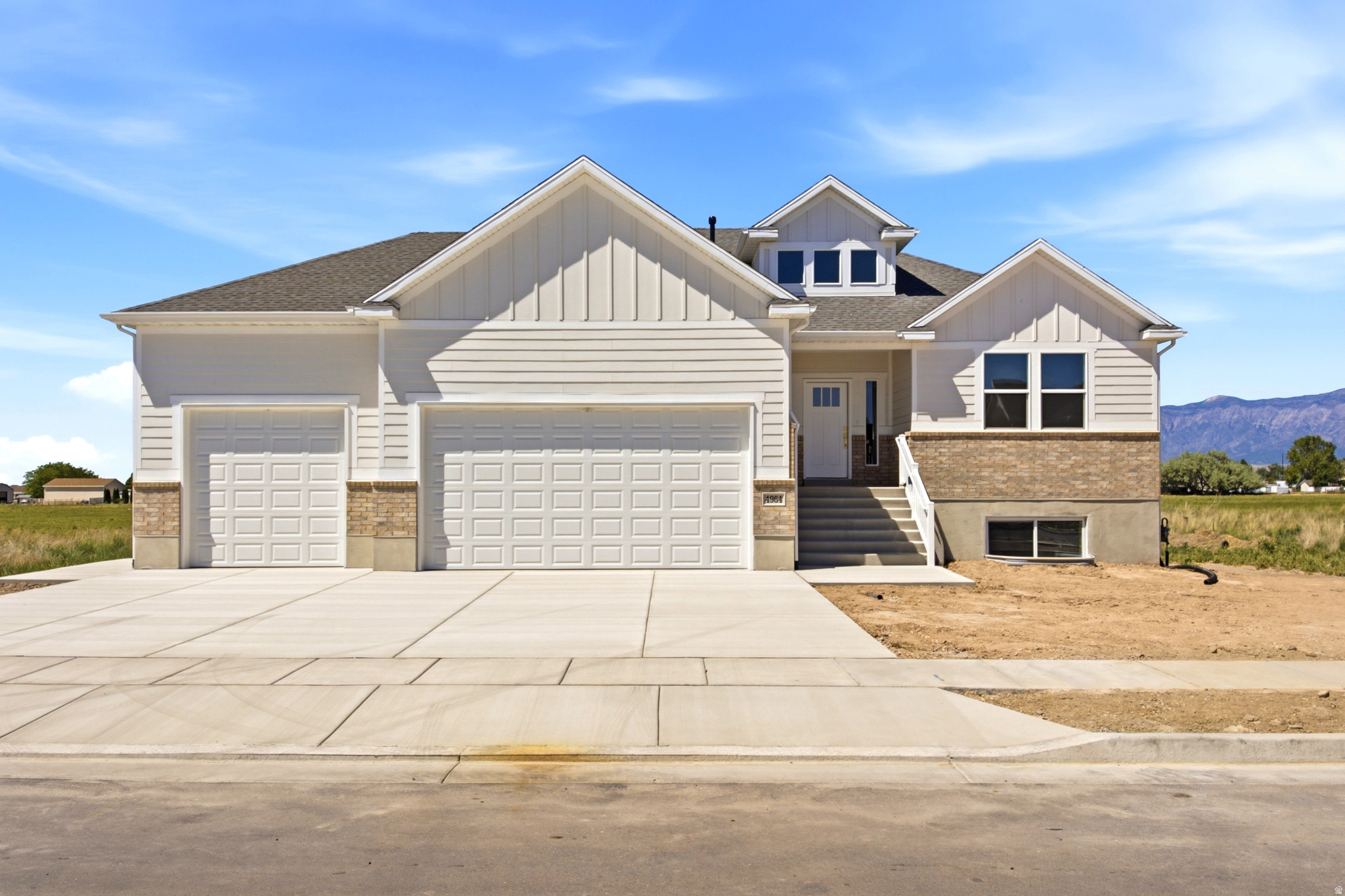 Brand new, Beautiful south-facing home located in West Haven's desirable West Ridge subdivision. This 5-bedroom, 3-bathroom, fully finished home features a spacious kitchen, inviting living areas, and a stunning primary suite with a large walk-in closet, separate tub, and beautiful walk-in shower. The walkout basement includes an ADU complete with its own kitchen and living room, offering excellent flexibility for extended family, guests, or rental income potential. Enjoy outdoor living on the covered deck, a spacious yard perfect for entertaining, and plenty of storage in the 3-car garage.
