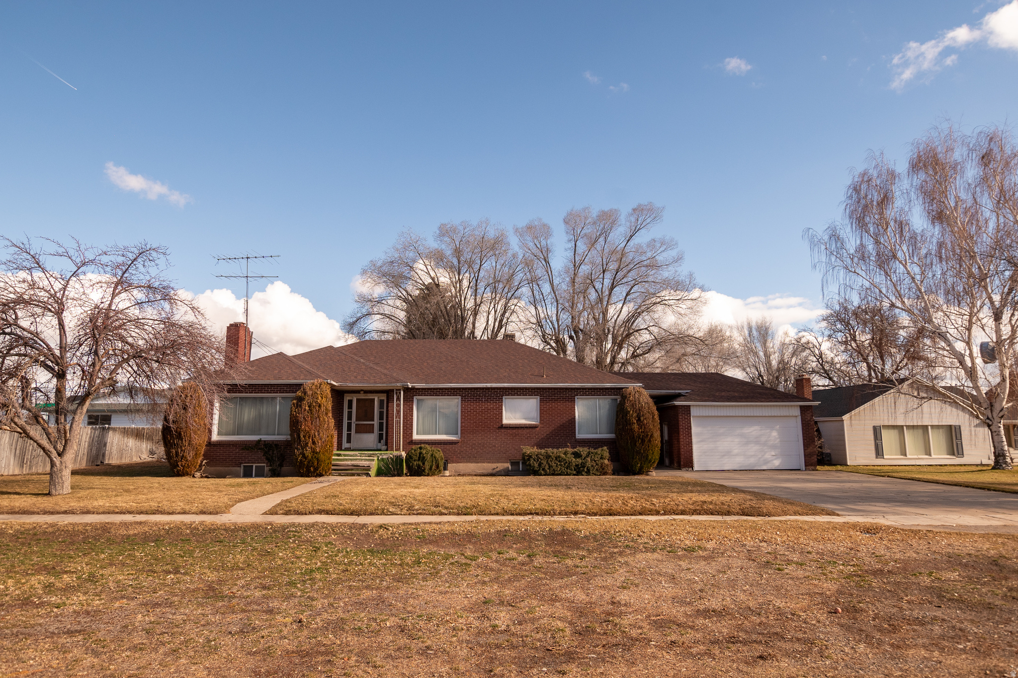 Discover timeless appeal in this full-brick gem, where classic character meets practical living. The sturdy brick exterior offers enduring durability and enduring curb appeal, while a detached garage and workshop provide ideal space for hobbies, projects, or extra storage. Set on a large lot in a superb location, this property has room to grow and plenty of outdoor living potential. Inside and out, you'll find versatile spaces and thoughtful touches. A basement adds flexible space for storage, a workshop, or future finishing touches. Outdoors, a large yard and a covered patio invites gathering, entertaining, or quiet evenings outside in any season.