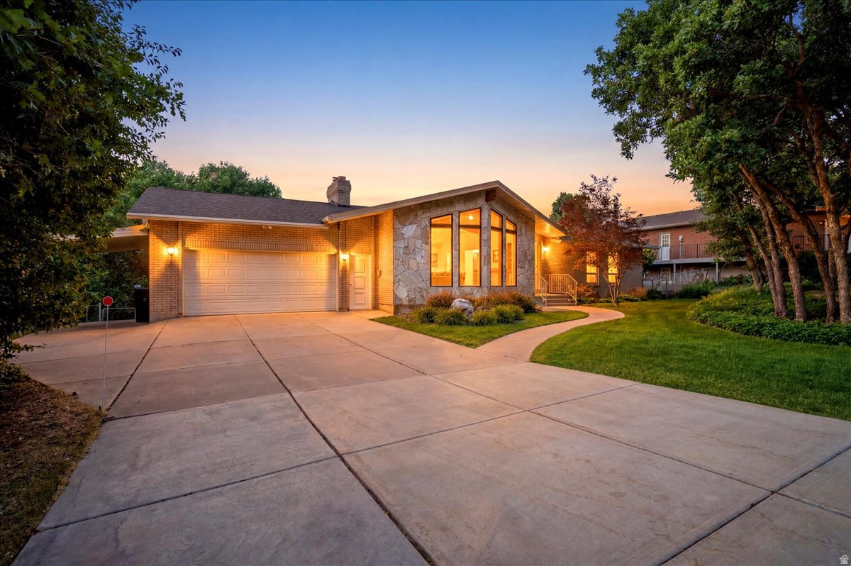 Nestled on a beautiful nearly half-acre lot, this spacious 5-bedroom, 5-bath home offers the perfect blend of comfort, functionality, and breathtaking surroundings. Enjoy scenic views, mature trees, and a charming gazebo that create a peaceful outdoor retreat with plenty of space to relax or entertain. Inside, you'll find generous living areas and exceptional storage throughout the home, including the basement and garage. The fully equipped walkout basement features its own private entrance, a full-size kitchen, and a cozy fireplace-ideal for multi-generational living, guests, or added flexibility. All appliances are included, making this home truly move-in ready. Best of all, there's no HOA! Conveniently located just minutes from Hill Air Force Base, shopping, dining, and everyday amenities, this property offers the space, versatility, and location you've been searching for. Schedule your showing today!