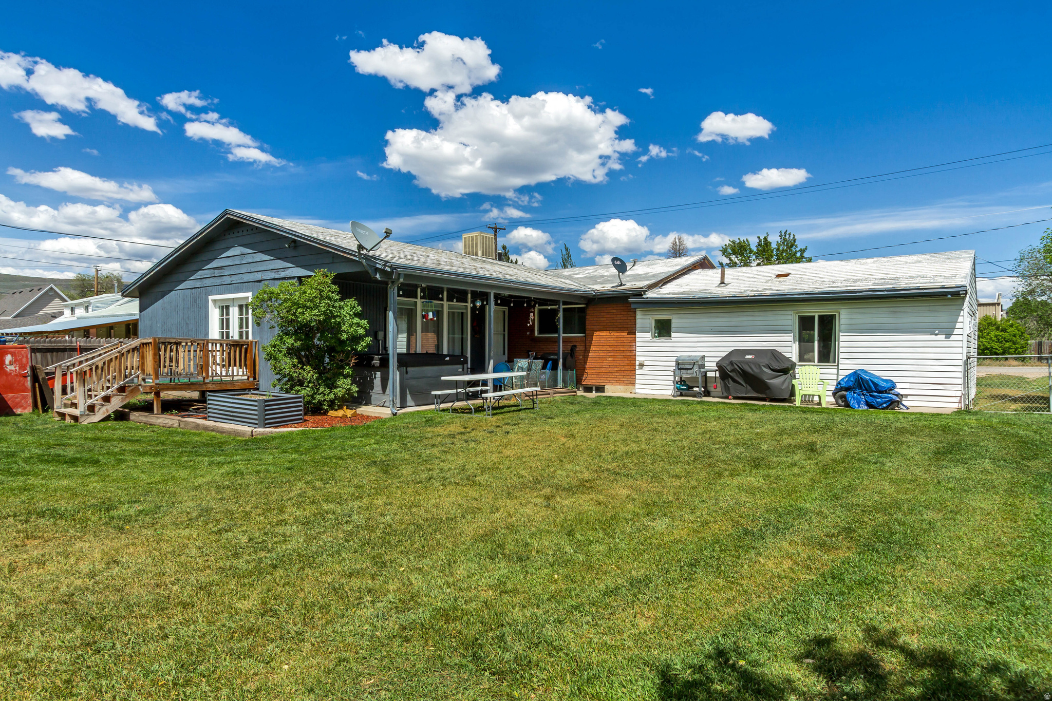 This beautiful, clean home is centrally located in Heber City, providing convenient access to downtown shopping, dining, and nearby outdoor recreation areas. Designed for main-floor living with an open-concept layout optimized for gathering and entertaining. The lot features a generous 0.34-acre parcel, offering substantially more outdoor space than standard downtown lots and ample parking. The basement includes a vast lower-level footprint dedicated primarily to storage, along with one completed bedroom. Basement potential features plumbing or space configurations that allow the future owner to build out an additional bathroom.  Excluded: Washer, Dryer, Fridge & Freezer in spare bedroom. Square footage figures are provided as a courtesy estimate only and were obtained from county records.  Buyer is advised to obtain an independent measurement.