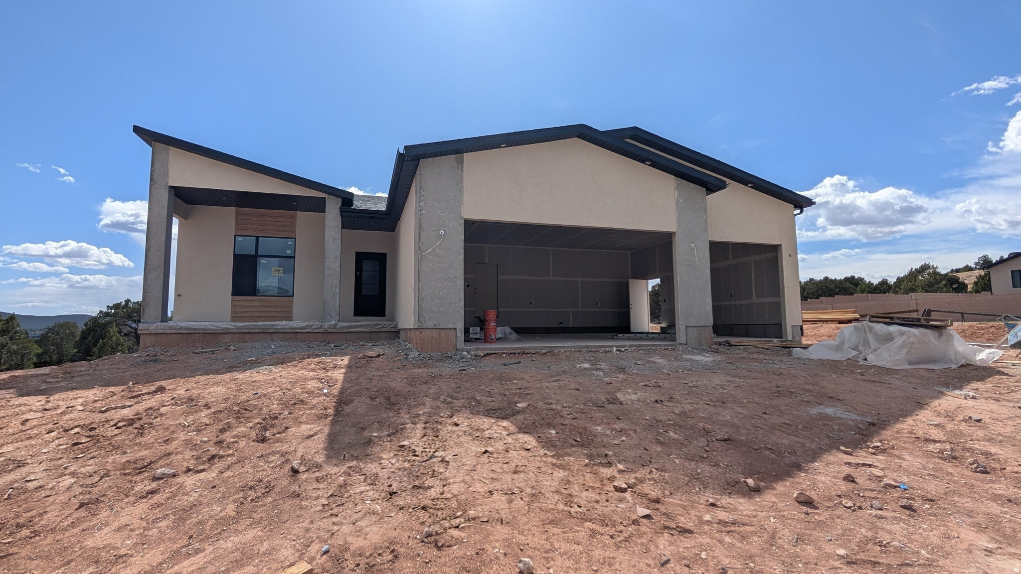 PRESALE-Modern style meets smart design in this Belmont floor plan by Hyve Homes in the highly sought-after South Mountain area of Cedar City. The exterior showcases a striking blend of stone, stucco, and siding, set against scenic Shurtz Canyon views. The daylight walkout basement features a private 2-bedroom ADU with its own entrance, full kitchen, dining, living room, and bathroom--ideal for guests or rental income. The main level offers 9-ft vaulted ceilings, a gourmet kitchen, and a spacious walk-in closet with washer/dryer. Enjoy the deck with spiral staircase, a stunning covered front porch, and extra deep garage, no HOA community with fiber internet, just minutes from town & near Zion National Park, Brian Head Resort, and Sand Hollow State Park--plus a short drive to St. George.