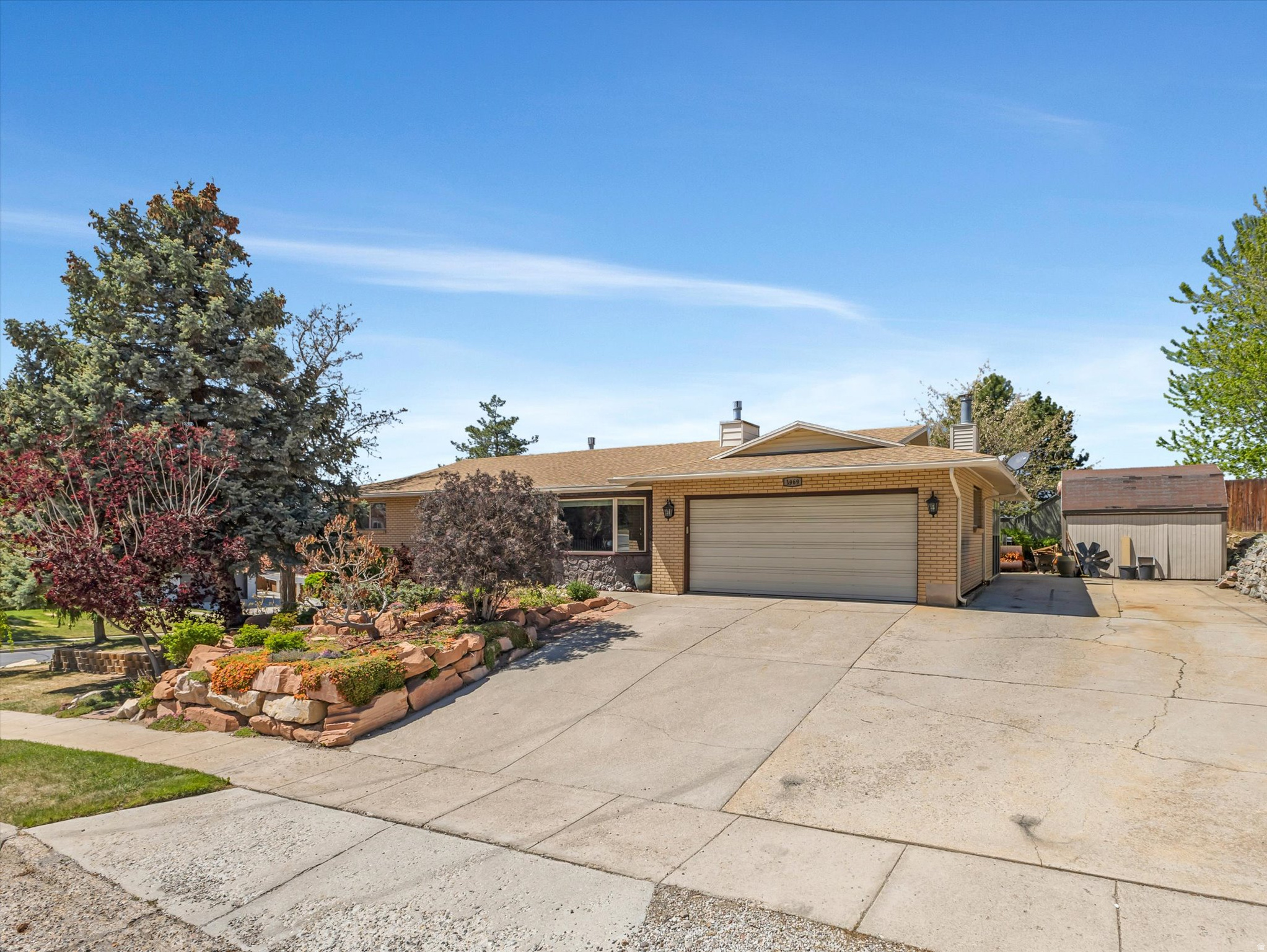 Perfectly positioned on the Sandy East Bench, this 5-bedroom, 3-bathroom home offers a refined living experience with unbeatable scenery and gorgeous views. The interior features a spacious, updated layout highlighted by a large primary suite designed for relaxation, complete with a modern free-standing tub, a beautifully updated bathroom, and a generous walk-in closet. The living space extends outdoors to a massive deck-the perfect vantage point for taking in spectacular valley views and sunsets. Surrounded by meticulous landscaping, this private retreat offers a quiet escape while remaining just minutes from the world-class recreation of Little Cottonwood Canyon.
