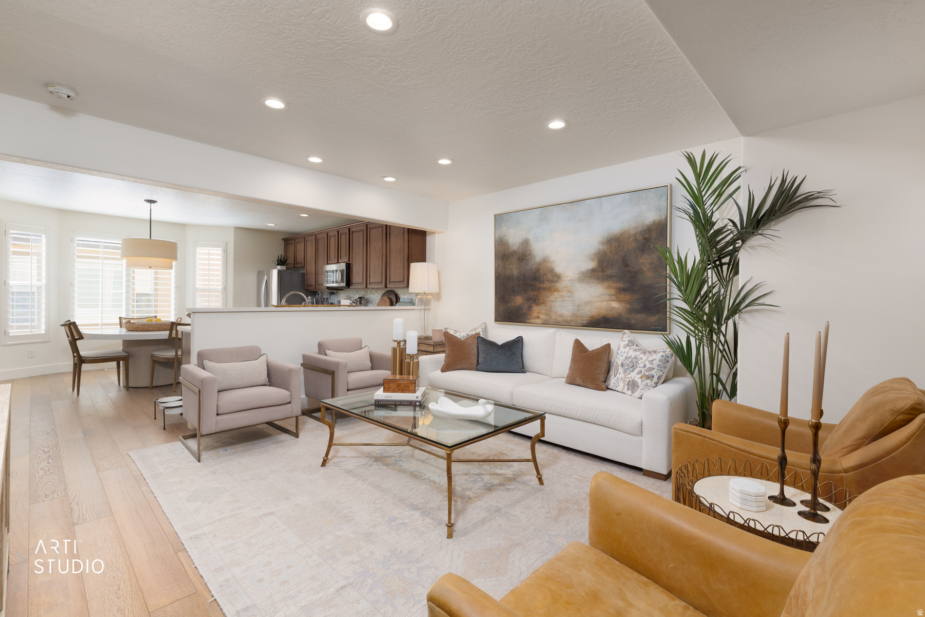 Beautifully appointed townhome in the Waverly Station community. Offering 3 bedrooms, 3 bathrooms, and over $70,000 in high-end upgrades completed since 2022, this home showcases a level of craftsmanship and design typically reserved for luxury residences.  The kitchen features Quartz countertops, stainless steel appliances, a five-burner gas cooktop, and double ovens. Throughout the home, you'll find custom tile work, hardwood flooring, stunning inlaid staircase details, plantation shutters, and designer finishes that create a warm and sophisticated living environment. The finished two-car garage adds both convenience and functionality.  Thoughtfully curated and beautifully executed, the interior feels as though it was lifted straight from the pages of Architectural Digest. Every detail has been carefully selected to create a home that is both elegant and inviting.  Public walkway directly from the Waverly Station parking lot to the  Trax railway system, which connects to Frontrunner. This home offers exceptional access to commuting, shopping, dining, and recreation. Directly across the street, Harmony Park features tennis courts, baseball fields, expansive green space, and a large playground. Waverly Station is a beautifully maintained community known for its attractive landscaping and welcoming atmosphere. Buyers to verify all information to their own satisfaction.  This home is truly move-in ready. A complete list of upgrades is available upon request. 3706 S Luchars Ln SLC, Utah 84115