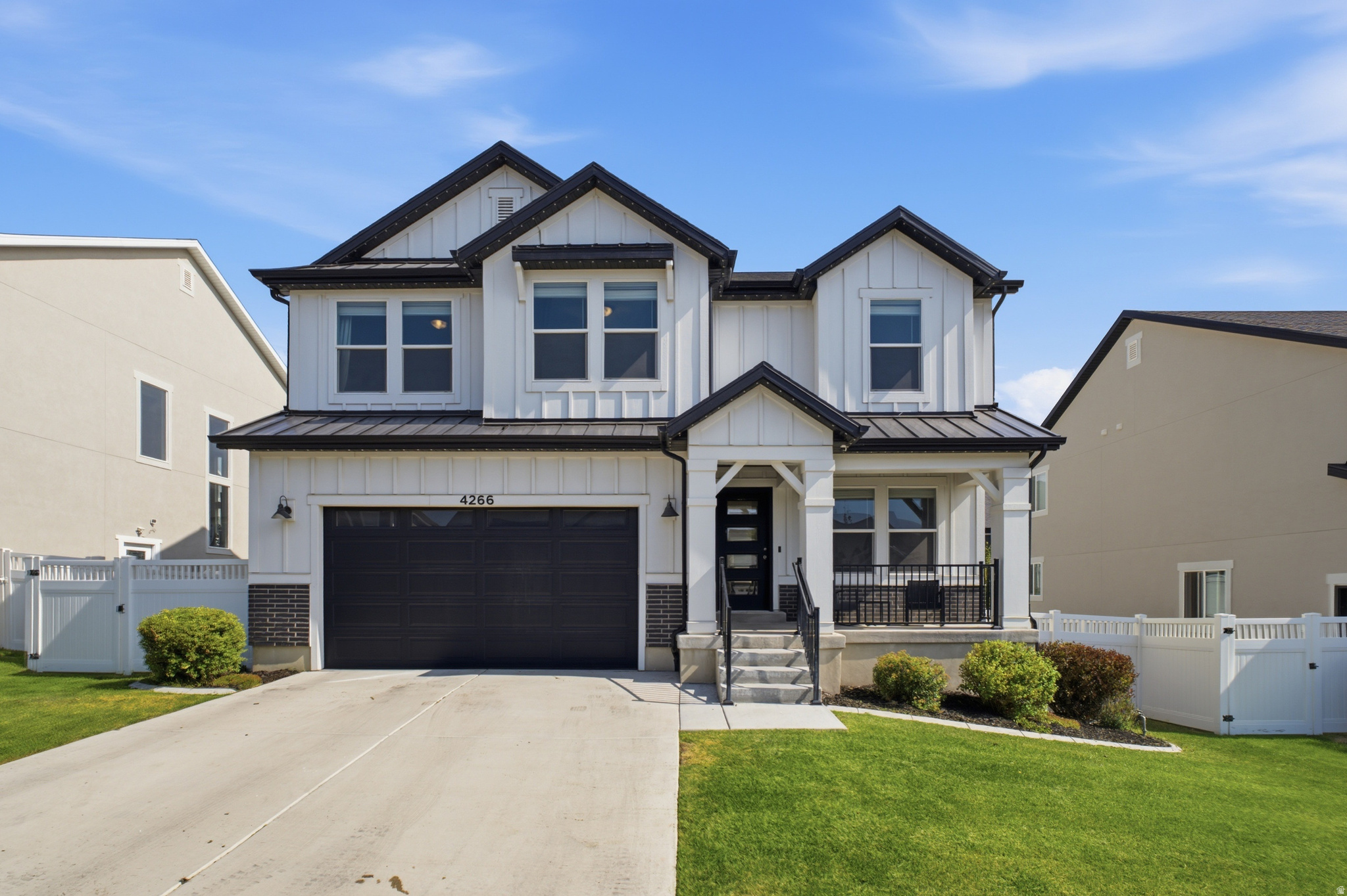 Welcome to the kind of home that simply makes life easier.  Located in Herriman's highly desirable Mountain Ridge community, this beautifully designed 6-bedroom home offers the perfect blend of modern style and functional living. The open-concept main floor features sleek finishes, a dedicated flex room ideal for a home office or playroom, and spaces designed for both everyday life and entertaining.  The fully finished basement sets this home apart with two additional bedrooms, a kitchenette, and a cozy fireplace-a rare combination that creates the perfect space for guests, multigenerational living, or an incredible second gathering area.  Outside, enjoy a professionally landscaped backyard complete with low-maintenance turf, a putting green, and a spacious deck that's perfect for relaxing or hosting friends and family.  Just minutes from Mountain View Village, Costco, restaurants, shopping, entertainment, and everyday conveniences, this home offers an unbeatable location in one of Herriman's fastest-growing communities. Modern, versatile, and move-in ready-this is one you won't want to miss.