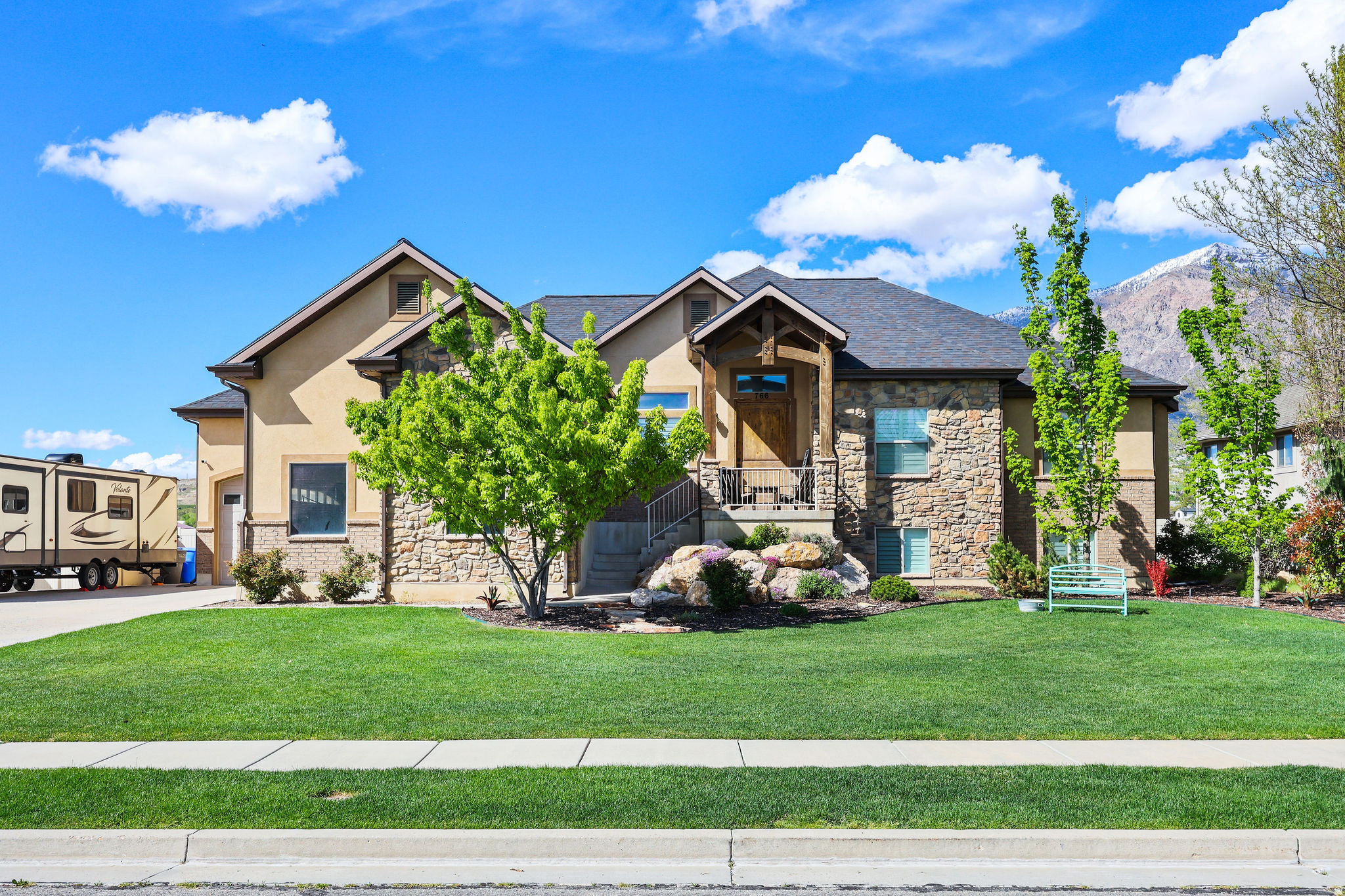 Welcome to your dream home in Pleasant View-where stunning curb appeal, comfort, and breathtaking mountain views come together in one exceptional, move-in-ready property. From the moment you arrive, you'll notice the pride of ownership and inviting atmosphere that carries throughout-enhanced by recent upgrades including a new roof, updated flooring, modern fixtures, stylish lighting, a new water heater, and refreshed landscaping.  Step inside to a bright, open great room featuring soaring inverted vault ceilings, abundant natural light, and a cozy fireplace-perfect for both relaxing evenings and entertaining guests. The updated kitchen shines with new countertops, modern appliances, and a functional layout that seamlessly connects to the main living space.  Offering 5 spacious bedrooms and 3 well-appointed bathrooms, this home provides plenty of room to live, work, and unwind. The fully finished basement is packed with extras, including a dedicated theater room ideal for movie nights, along with a custom-built secure room concealed behind a vault-style door.  Out back, enjoy one of the home's most impressive features-unobstructed mountain views with no backyard neighbors. Host gatherings on the covered Trex deck, or relax around the firepit in the spacious yard below. A climate-controlled storage shed adds versatility for hobbies, workspace, or additional storage.  Don't miss the epoxy-coated garage floors that add both durability and a clean, polished look to the oversized garage space.  With space, upgrades, privacy, and views, this home truly checks all the boxes. Schedule your private showing today!