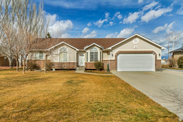What an Incredible price on this Beautiful Rambler on .56 Acres!  This home comes with a NEW 26 X 30 SHOP AND A NEW 15 X 24 CARPORT for ALL YOUR TOYS AND PROJECTS.  Enjoy Serenity on your own half acre with large trees and plenty of parking and you are only 20 minutes from the Stansbury Mountain range with camping, hiking and fishing. Clean-Clean-Clean. A NEW Roof, NEW Hot Water Heater and NEW HVAC system installed. NEW counter tops, NEW GAS Range and Backsplash in your open kitchen. NEW fence around your backyard. NEW Shower in the master bath. NEW Front Door and Back patio doors and so much more. Only 35 minutes to the Salt Lake City International Airport. The Basement is 90% finished with 2 more bedrooms, a Full bathroom and a Huge Family Room to enjoy a movie or games on those colder days. The garage and shop are both wired with 220 power. Stunning Hardwood floors in the kitchen and hallway have been refinished. Lots of Natural light. Fully insulated garage with multiple outlets. Tons of storage. Living room has natural gas available for a fireplace. Polyurethane insulation throughout and manabloc plumbing. This TURN-KEY home is the perfect place to make new memories for the holidays or have a quiet BBQ in the backyard. Don't let this home pass you by. SELLER IS OFFERING $5,000 TO THE BUYER AT CLOSING TO USE FOR WHATEVER THEY FEEL NECESSARY.