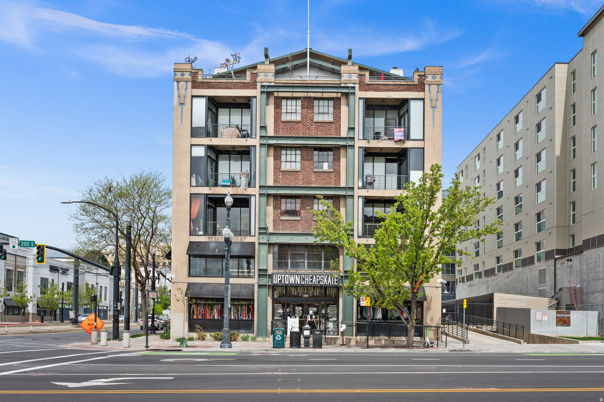 Welcome to a rare work/live downtown unit with its own private, secured entrance gate off of 400 West, across from the Gateway Mall. This condo is located in the coveted Dakota Lofts, a historic 1923 building that has been earthquake-reinforced. Free 2-hour parking is conveniently available for guests in front of the entrance, along with a nearby Trax stop in the free zone. This area is only steps away from the Delta Center home of the Utah Jazz and Utah Mammoth. Walking to restaurants, Salt Palace, Farmers Markets and Pioneer Park make this the perfect urban loft from which you can live, work, and play downtown. This two-story condo was recently improved with fully custom, high-end features. It includes a built-in, two-person workstation and half-bath downstairs, providing a useful work environment. Space upstairs is maximized with a full custom kitchen with KitchenAid refrigerator, freezer, and dishwasher drawers, plus a built-in microwave, Super Susan pantry, and new range. The custom bamboo cabinetry features plenty of storage with full-extension, soft-close doors and drawers. The primary bath and roomy sleeping area are adjacent to the kitchen, and mature trees create privacy on the balcony. Stained concrete floors, exposed brick and ductwork, and floor-to-ceiling windows add charm to this industrial loft. Google Fiber is available, and EV station infrastructure is being installed. This unit is not part of a rental cap, but it must be a one-year-minimum lease, it offers gated/secured designated parking and a large storage unit, and its walls have increased soundproofing. The Buyer and Buyer's Agent are responsible to verify all listing information, including square feet/acreage, to Buyer's own satisfaction. Owner/Agent in Utah