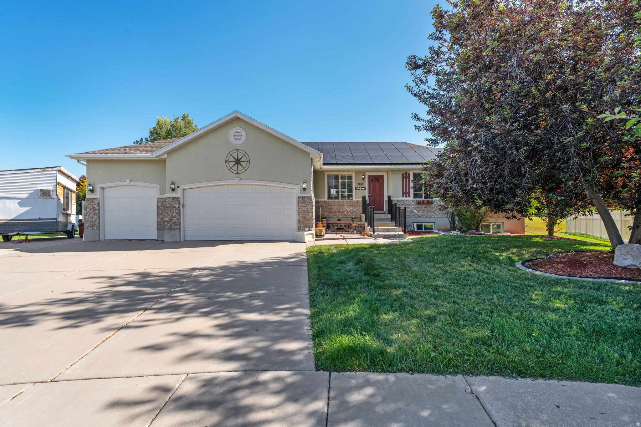 This beautiful property is perfectly situated at the end of a quiet cul-de-sac and backs up to a golf course in a vibrant area of Syracuse with quick access to the new West Davis Corridor.  The open floor plan and spacious basement make this house perfect for entertaining.  Rooftop solar panels (owned, not leased) with legitimate battery backup power the home. Huge garage is heated and has a built-in air compressor, making it an excellent work space with plenty of room to park vehicles as well.  Both the garage and RV pad have 220 for your RV or electric vehicle.