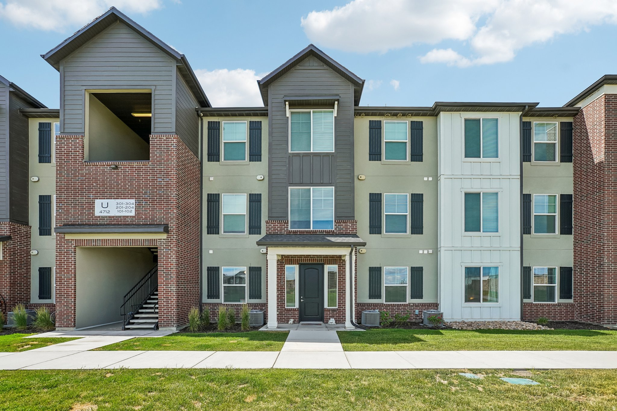 One of the most desirable floor plans and locations in the community! This townhome is one of the few units with a true front-door entrance, opening to a large, open green space, creating a more inviting and open feel from the moment you arrive. Inside, you'll appreciate the spacious layout with more square footage than many other units in the complex, including an oversized entryway and an expanded primary suite featuring a cozy reading nook. The bright, modern interior offers 9-foot ceilings, quartz countertops, stainless steel appliances, gray cabinetry, neutral white paint, and an open-concept design that's perfect for everyday living and entertaining. Additional features include an on-demand water heater, closet organizers throughout, abundant storage, and overhead garage storage racks to maximize space, EV charging station. Thoughtfully designed with a no-step entry, wider 36-inch doorways, and 39-inch hallways for long-term comfort and added accessibility. Ideally located within walking distance of the local elementary and high school, you'll also enjoy quick access to Mountain View Village shopping and dining, Blackridge Reservoir, walking trails, Mountain View Corridor, and the community clubhouse and swimming pools. With its premium location, larger floor plan, and numerous upgrades, this home is a standout in the community. Don't miss your opportunity to make it yours-schedule your private showing today!