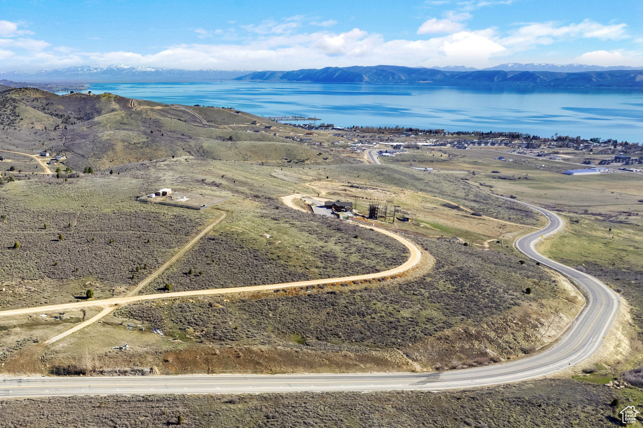 Exceptional Development Opportunity - Panoramic Bear Lake Views. 102 acres perched above Garden City offering stunning, end-to-end views of Bear Lake. This versatile property is zoned for hotel/motel, commercial, multi-family, single-family, or a combination-making it ideal for a wide range of development opportunities. A PID (Public Infrastructure District) has already been approved, making the property development-ready. With City approvals in place for density, this parcel can be part of the Shundahai Planned Community or developed independently. It surrounds the popular Bridgerland Adventure Park and offers two convenient access points from Hwy 89. Enjoy breathtaking views overlooking the charming community of Garden City, Utah and the full 20-mile stretch of Bear Lake. Outdoor enthusiasts will appreciate the close proximity to Bear Lake State Park Marina and hundreds of miles of scenic mountain trails. Whether for investment, development, or private use-this property is truly one-of-a-kind.