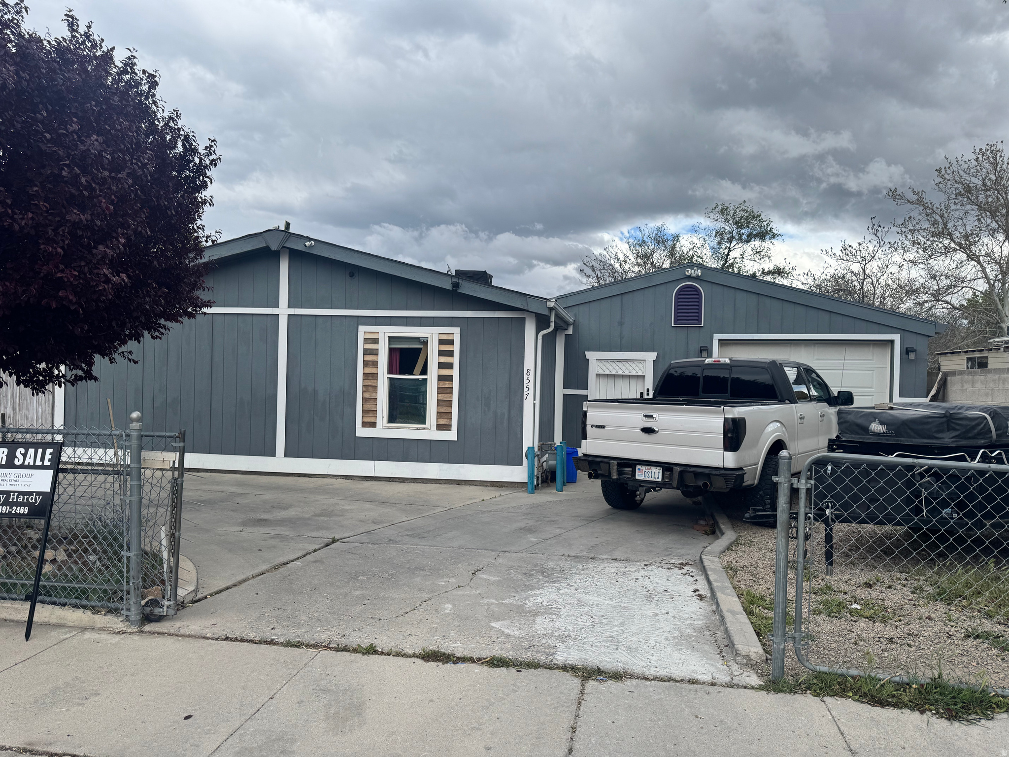Don't miss out on this charming manufactured home located in West Jordan, featuring four spacious bedrooms and two bathrooms. The property boasts updated bathrooms and kitchen cabinets, showcasing modern finishes throughout. Additional highlights include a large attached one-car garage and multiple sheds for ample storage. With a fully fenced yard, this home offers both privacy and security, making it an ideal retreat. Conveniently situated near shopping and essential services, this residence combines comfort with accessibility, making it a perfect choice for families and individuals alike.  Square footage figures are provided as a courtesy estimate only and were obtained from Salt Lake County Assessors Office .  Buyer is advised to obtain an independent measurement.