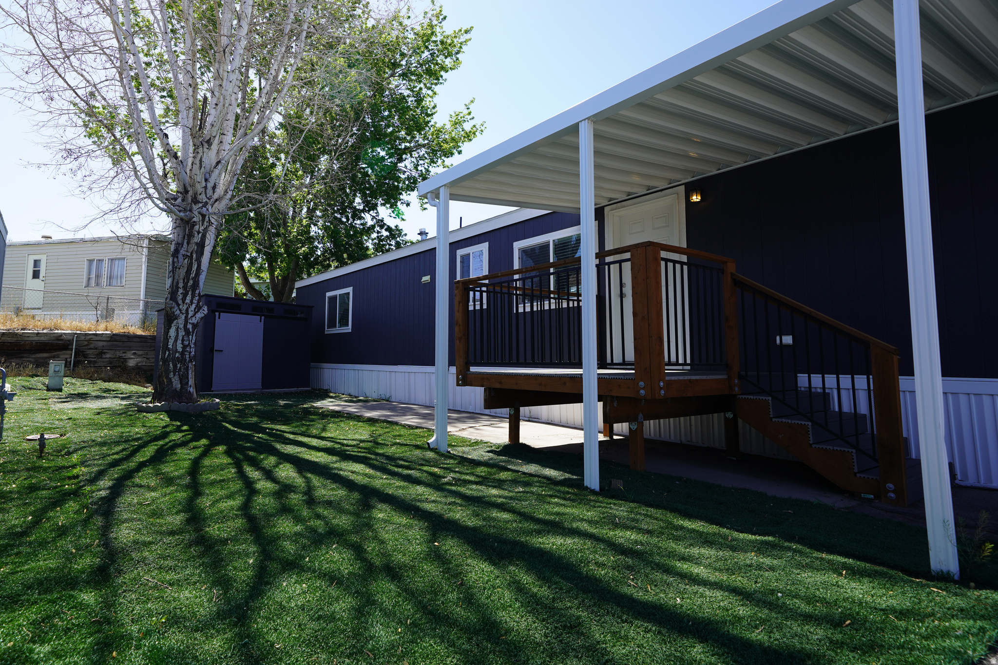 It's pretty rare to find a home option in Orem for under $150k, let alone one that is only  a couple of years old, but here you have it!  Why rent an apartment when you can own and enjoy life with no shared walls, floors, or ceilings with adjacent neighbors.  This home was built in 2023 and has been well taken care of.  Not only is everything still basically new, there is a transferrable parts and labor warranty on the AC system through Whipple that is still good until 2033, to give you some peace of mind.  The yard was finished with artificial turf which makes the maintenance a breeze.  The shed was set on a concrete pad which provides a lot of extra storage.  With 3 dedicated parking spaces for this unit, and additional guest parking very close by near the clubhouse, you won't have to worry about parking issues when you have your friends and family over to visit.  Village Green is known for being a quiet community with a large park in the center and it is very common to see children at play as well as people walking their dogs.