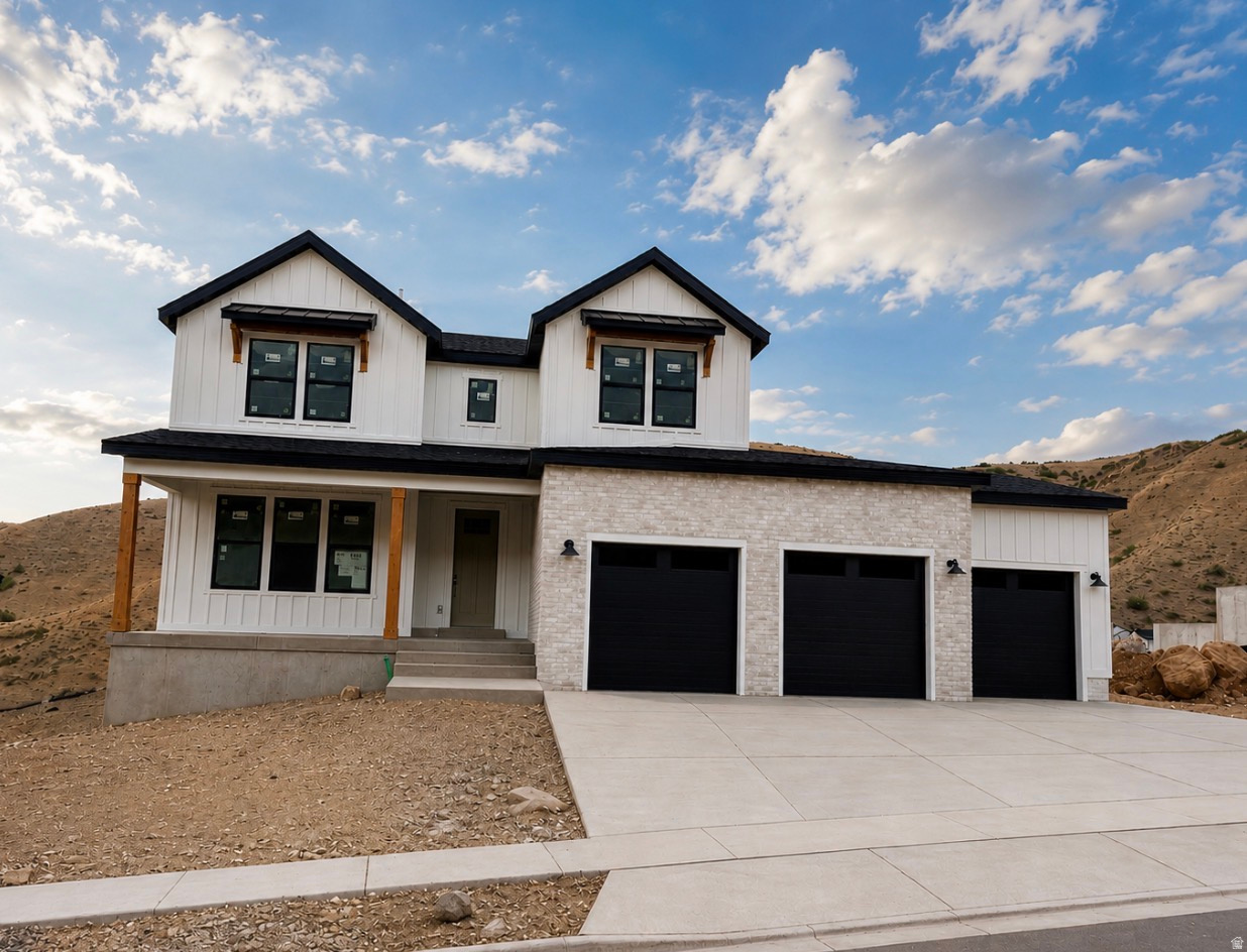 If you've been waiting for the right home in Traverse Mountain, this is the moment-and it won't last. Located in the final phase of Canyon Point, this is one of the last opportunities to own a brand-new home in this highly sought-after community, where demand continues to outpace supply and remaining homes are quickly disappearing. Set on a premium canyon homesite, this stunning farmhouse two-story was intentionally designed to capture breathtaking valley views while offering the perfect balance of luxury, comfort, and everyday functionality. The highly desirable Sage floor plan features a main-level owner's suite and an open-concept layout highlighted by soaring ceilings and a dramatic two-story fireplace with custom shiplap detail that creates an unforgettable first impression. The home is loaded with upgrades that today's buyers are actively searching for but rarely find in one property. Enjoy a covered deck with sweeping valley views, a fully finished walkout basement ideal for entertaining or multi- generational living, and a highly coveted four-car garage. The exterior is elevated with striking black windows, adding a modern farmhouse aesthetic that stands out instantly. Inside, the gourmet kitchen is designed to impress with a premium KitchenAid appliance package, cabinetry extended to the ceiling, and tile carried all the way up for a clean, high-end finish. Quartz countertops are featured throughout, including a large island, while designer gold-finish pendants and faucets add warmth and sophistication. The owner's suite delivers a true retreat experience, complete with an on suite bath that includes a walk in shower and a Maxx Brioso freestanding tub. Situated on a spacious .22-acre lot, this home provides a level of space and privacy that is becoming increasingly rare along the Wasatch Front. With completion scheduled for early August, this home is perfectly timed to hit the market as buyer demand peaks. And with Canyon Point nearing full build-out, opportunities like this are quickly vanishing. Living in Canyon Point means enjoying one of the Wasatch Front's last hidden gems, where hiking and biking trails begin right outside your door, a peaceful mountain setting surrounds you, and yet shopping, dining, and top-rated schools are just minutes away. Residents also enjoy access to a luxury clubhouse, fitness center, resort-style pool, and sport courts, creating a lifestyle that is difficult to replicate. Contact the primary listing agent and visit the model home today to experience the builder's finishes firsthand and learn more about the property-because once this home is complete, expect strong traffic and fast movement. Builder willing to pay for a 5%, 30 year fixed interest rate for buyers qualified to close within 30 days! Certain terms and conditions apply, contact listing agent for additional information.