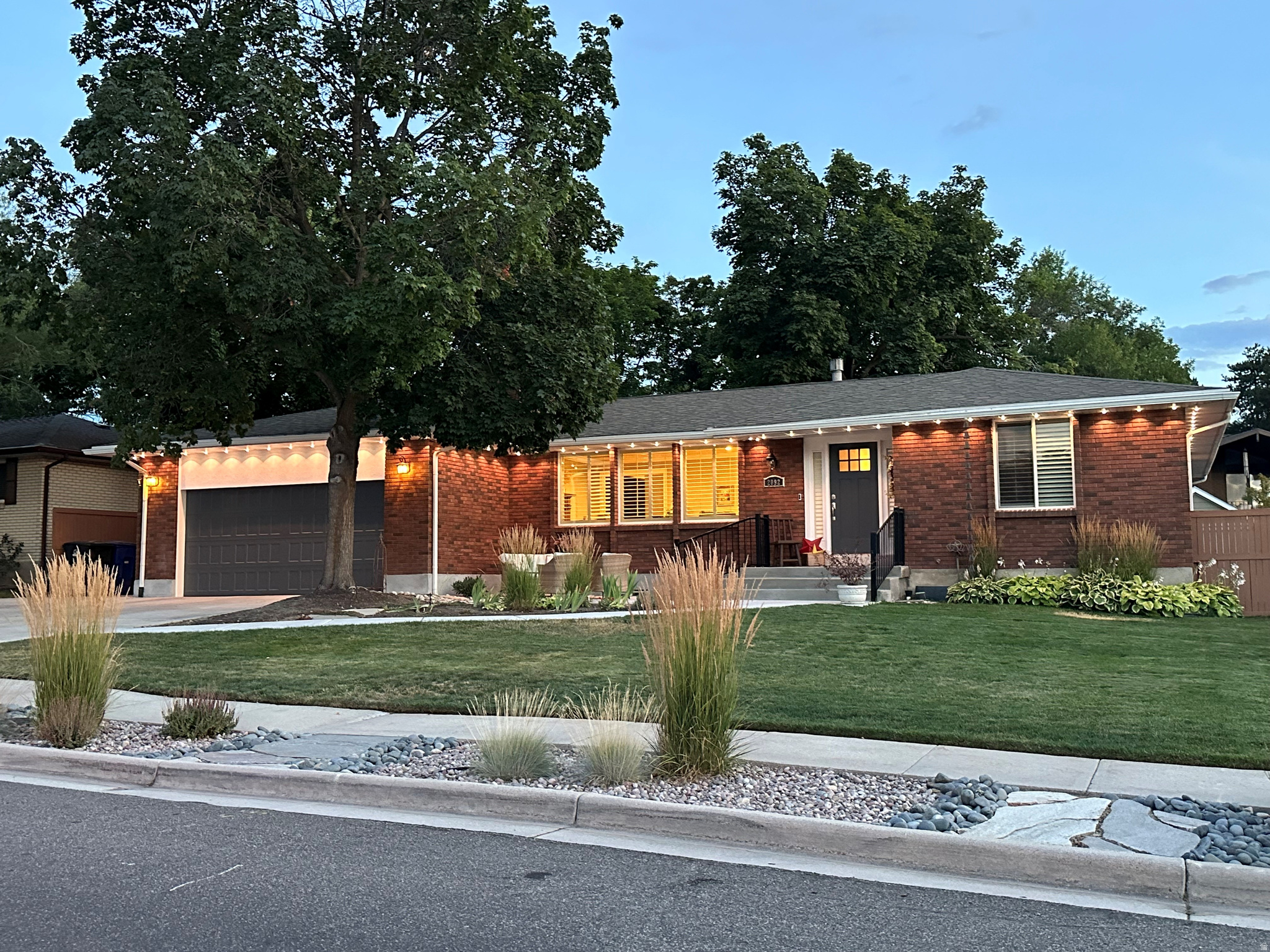 Perched in a highly desirable Cottonwood Heights neighborhood with breathtaking Wasatch Mountain views, this meticulously maintained rambler combines timeless craftsmanship with thoughtful, high-end updates throughout. Designed for both everyday comfort and effortless entertaining, the home offers multiple gathering spaces, including an inviting living room with a gas fireplace, an expansive great room surrounded by windows, and a dedicated office just off the entry. The stunning 2024 remodeled kitchen showcases premium finishes, including granite countertops, maple cabinetry, a counter-depth stainless refrigerator, KitchenAid wall oven, microwave and dishwasher, Fisher & Paykel induction cooktop, extra-deep stainless sink, and abundant workspace for the home chef. The fully finished basement provides spacious bedrooms, a dedicated exercise room, flexible recreation space, and abundant storage. The finished, insulated garage features mezzanine storage, extensive cabinetry, upgraded lighting, numerous electrical outlets, and a LiftMaster garage opener with battery backup. Outdoor living is equally impressive with mature landscaping, multiple patios, raised garden beds with drip irrigation, a cedar privacy fence, storage shed, and commercial-grade playground. The oversized driveway includes dedicated RV parking with a 30-amp electrical hookup. Ideally located just minutes from the Cottonwood Heights Recreation Center, enjoy year-round amenities including indoor and outdoor pools, a fitness center, ice arena, basketball gym, indoor walking track, racquetball and pickleball courts, childcare, and a wide variety of community programs. Adjacent Butler Park offers additional green space, sports fields, playgrounds, and walking paths, creating an exceptional setting for an active lifestyle. Pride of ownership is evident throughout this exceptional home, ideally located near world-class skiing, hiking and biking trails, parks, shopping, dining, and top-rated schools. A rare opportunity to own a beautifully updated home offering spectacular mountain views, outstanding amenities, and an unmatched Cottonwood Heights lifestyle.