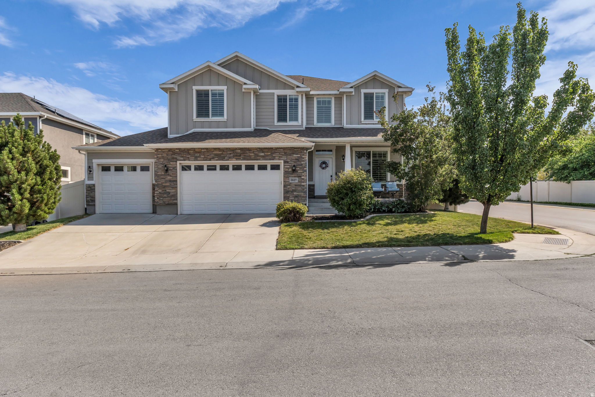 Elegant South Jordan home combining sophisticated design and modern efficiency. The main level features laminate hardwoods, plantation shutters, and a gourmet kitchen with granite counters, a central island, and double ovens. Offers 7 bedrooms and 3.5 bathrooms. The finished basement is built for leisure featuring a custom 8-seat theater and kitchenette. Equipped with solar panels and a fully fenced yard 8 with a drip-irrigation garden space. Convenient to local trails, parks, and shopping.
