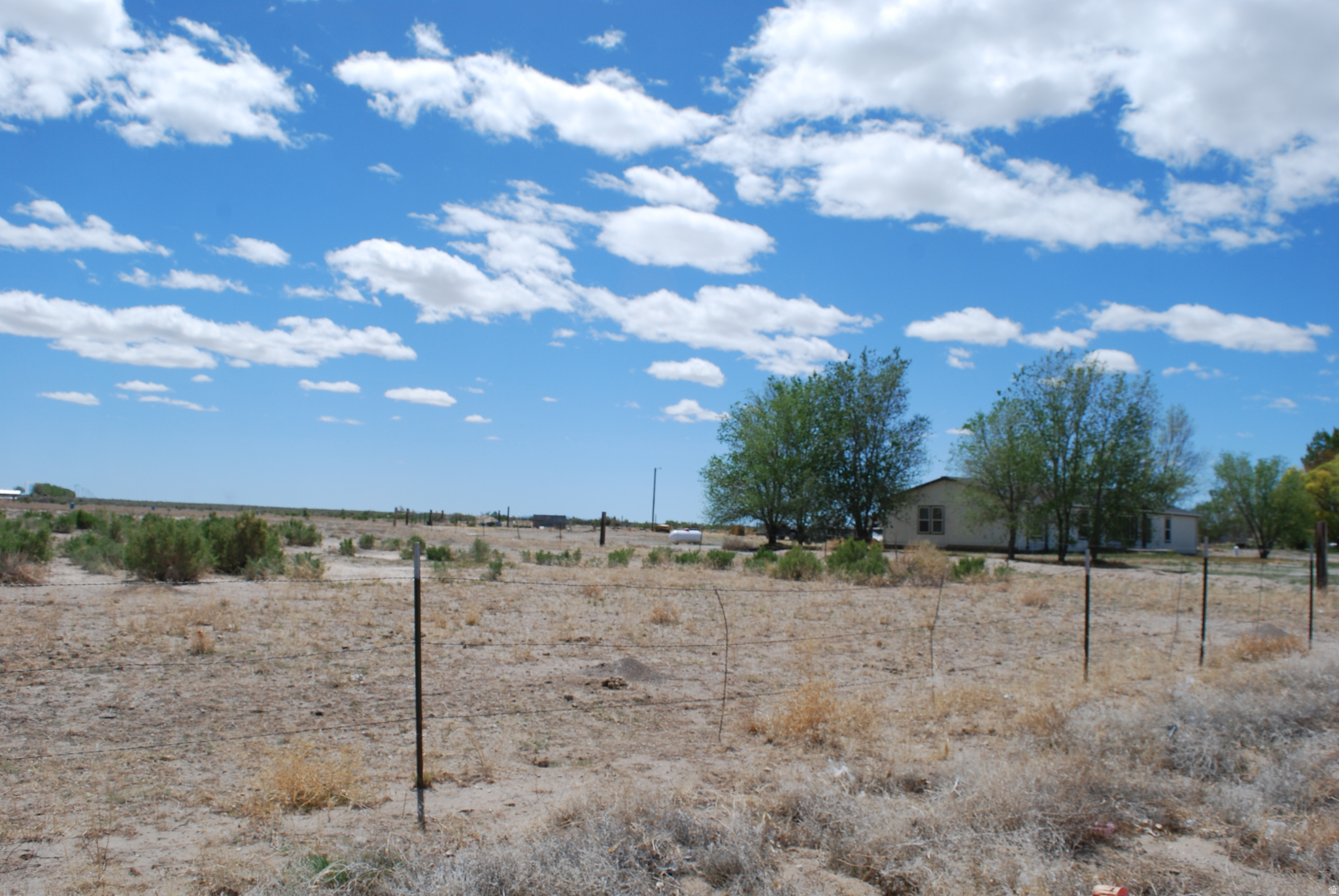 Great opportunity and property!  Zoned for commercial, residential and agriculture.  Presently part of larger lot with home.  Can be purchased together or divided to further develop to potential.  (See mls #2153304)  Land includes water rights.  Corner lot at Jones Rd. and Ashby Rd.