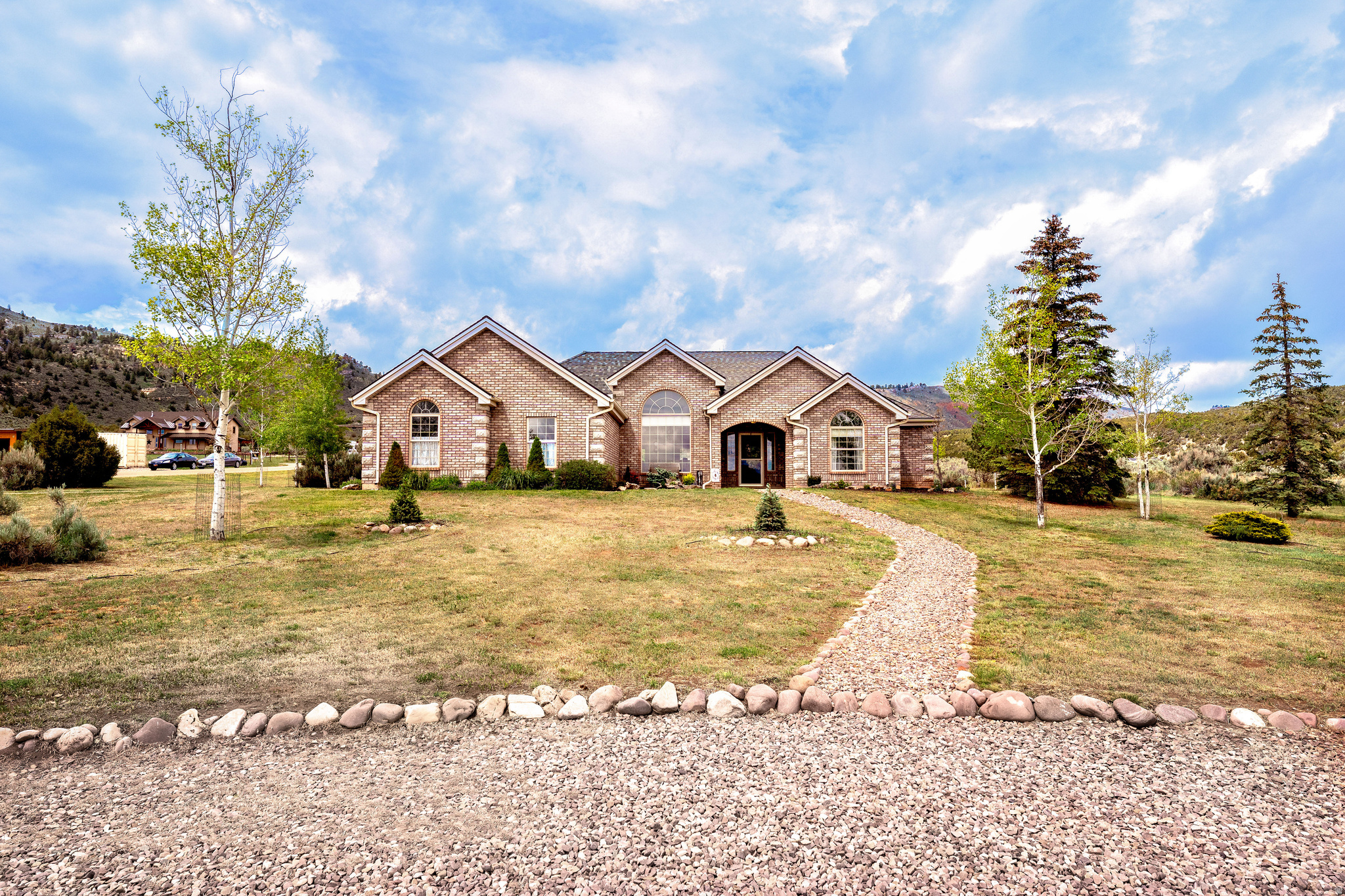 Welcome to the gateway of adventure! This home in Dry Fork Canyon doesn't just offer a roof over your head-it offers a lifestyle that most people only get to experience on vacation. Nestled on a 2-acre parcel in the historic and breathtaking Dry Fork Canyon, this 2,070 sq ft home is the perfect blend of comfort and self-sufficiency. Step through the covered front entry into this sanctuary with vaulted ceilings and natural light, this 3-bedroom, 2-bathroom home with a 2-car garage feels incredibly expansive. The kitchen is outfitted with a breakfast bar, gas stove, granite countertops, built in microwave, knotty alder cabinets, large stainless sink with rack and a high-end osmosis water softener system. Stay cozy with the ambiance of a wood stove insert (we're even leaving the some wood for you!) or enjoy the barefoot luxury of heated floors. The oversized master suite is a true getaway, and with walk-in closets in every bedroom, storage is never an issue. Relax under the custom pergola, perfectly set up for summer BBQs and starlit evenings. Features a fenced garden, a garden shed and two chicken coops, (shed and coop equipped with electricity), a full sprinkler system services the backyard, while dedicated drip lines keep the trees, bushes, and flowers thriving effortlessly. Why trailer your gear when you can live at the trailhead? Leave directly from your property on your side-by-side to explore endless canyon trails and the McConkie Ranch petroglyphs within Dry Fork Canyon.  You are a short drive to world class recreation, the Ashley Gorge Via Ferrata (the longest in North America!), premier mountain biking, and top-tier SUV trails, world-class fishing and boating at Flaming Gorge, Red Fleet, and Steinaker Reservoirs. Escape the hustle and breathe in the air of the high desert. This Dry Fork gem offers the rare opportunity to own a piece of Utah's cultural and natural heritage.  Buyer to verify all information and sq footage.