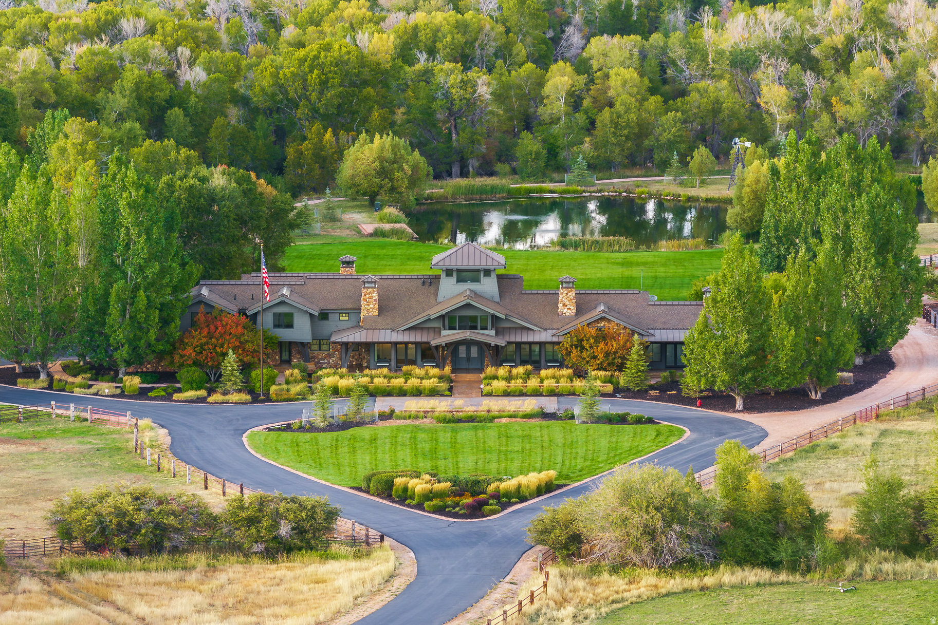 Star M Ranch is an irreplaceable 60-acre sanctuary in Oakley, Utah, where Weber River winds directly through the property and a large trout-filled pond anchors the landscape. Mature cottonwoods and open pastures create a private, park-like setting with mountain views in every direction. The ranch includes multiple horse pastures, a private forest, a newly remodeled 9,571 sf five-bedroom main residence, a guest house, a versatile artist studio near the water, and a massive new 16,800 sf party barn with an indoor pool, regulation size basketball court, fitness center, golf room, a lounge for gathering and entertainment, and indoor parking for 14+ vehicles. Designed for recreation and relaxation in every season, the property blends the spirit of the West with refined modern comfort in a setting shaped by water and open space. Whether casting a fly on the river, swimming in the indoor pool, or watching the sun set over the pond, the ranch offers an unmatched blend of recreation and relaxation all within 30 minutes of Park City.