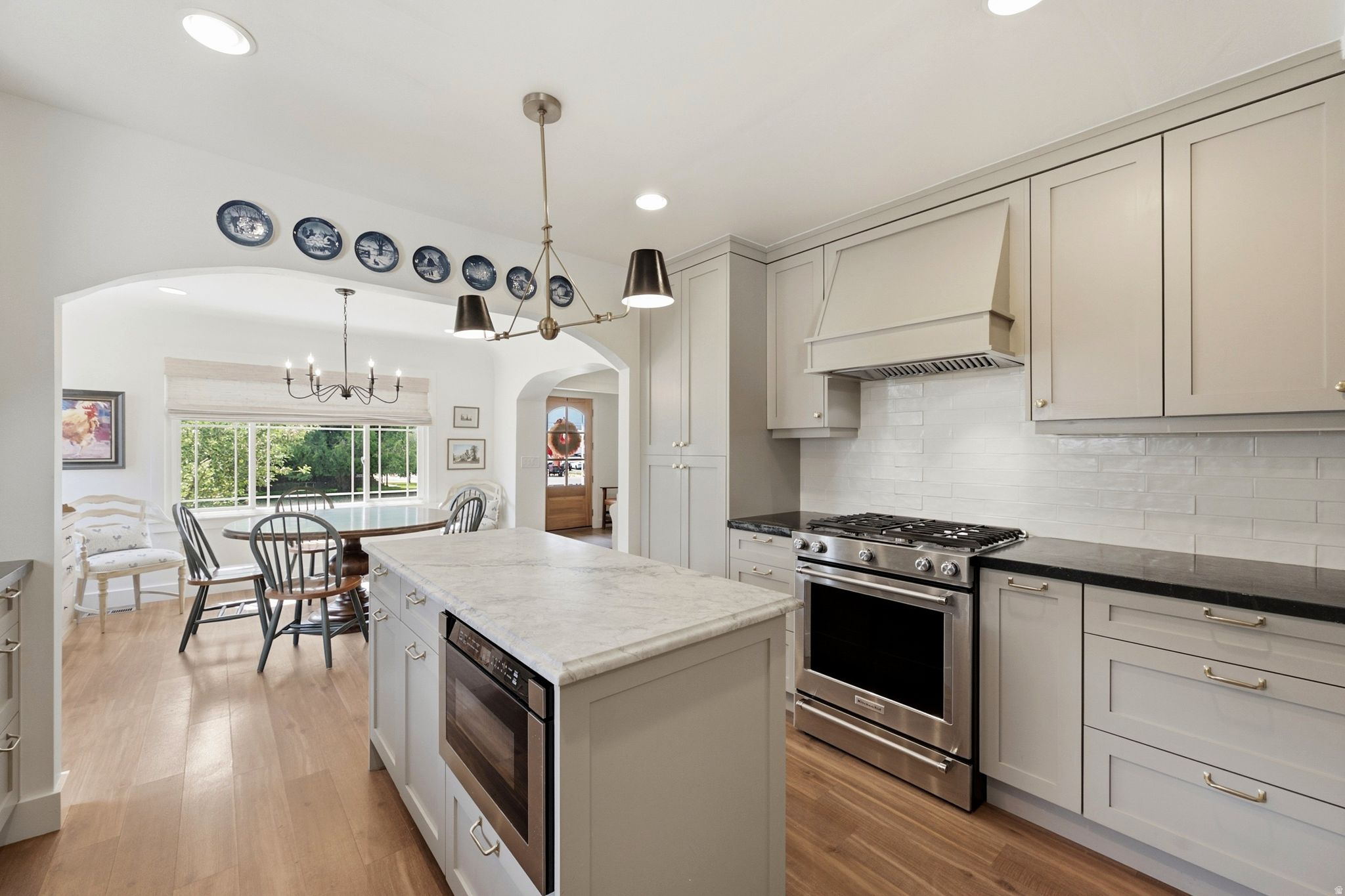 This charming four-bedroom cottage seamlessly blends timeless character with thoughtful modern updates. The beautifully remodeled floor plan is designed for both comfortable everyday living and effortless entertaining, creating a warm and inviting place to call home. The stunning kitchen features elegant granite countertops, updated finishes, and an open flow into the home's welcoming living spaces. A classic brick fireplace anchors the main living area, offering the perfect spot to gather on crisp mountain evenings. Sunlight pours through oversized windows, filling the spacious living and dining rooms with natural light. The main level offers two generously sized bedrooms, each with its own beautifully remodeled bathroom, providing comfort and privacy. Downstairs, you'll find two additional bedrooms, a spacious new bathroom, an oversized laundry room, and a second family room--ideal for movie nights, a playroom, or a quiet retreat. Outside, the expansive yard wraps around the home, creating plenty of space to relax, garden, and entertain. A flourishing apple tree and well-maintained vegetable garden add to the property's charm and appeal. The freshly painted garage offers ample room for vehicles, outdoor gear, and recreational toys, while the oversized driveway provides abundant additional parking. From holiday gatherings and summer barbecues to peaceful afternoons on Center Street, this delightful cottage offers the perfect setting to create lasting memories in one of Heber's most desirable locations.