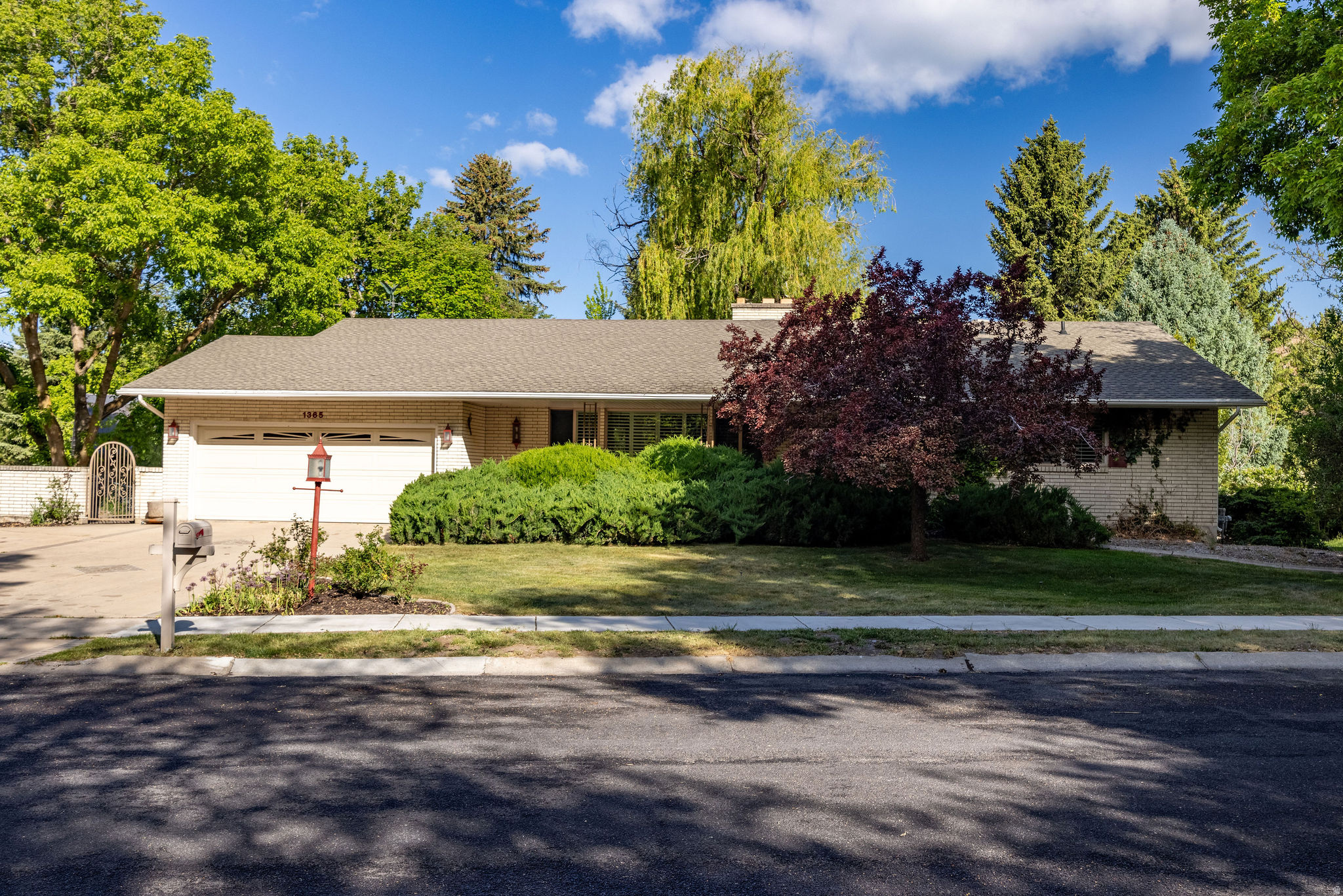 Rare opportunity to live directly on the Logan River with this classic brick rambler, situated in one of Logan's most sought-after neighborhoods. This well built home offers 5 generous bedrooms and 3.5 bathrooms. The main level has an expansive front living and dining room with Brazilian cherry wood floors, a double-sided gas fireplace and large front windows that offer plenty of natural light.  The kitchen has decorative tile work, double ovens, a separate fridge/freezer and a spacious walk-in pantry.  The living/dining area walks out to a private deck overlooking the Logan River.  The lower level is bright and airy with a walkout to the backyard.  There is ample storage and a dedicated workshop as well.  Do not miss your chance to own this riverside gem. Vacant and easy to show.  Buyer to verify all information.