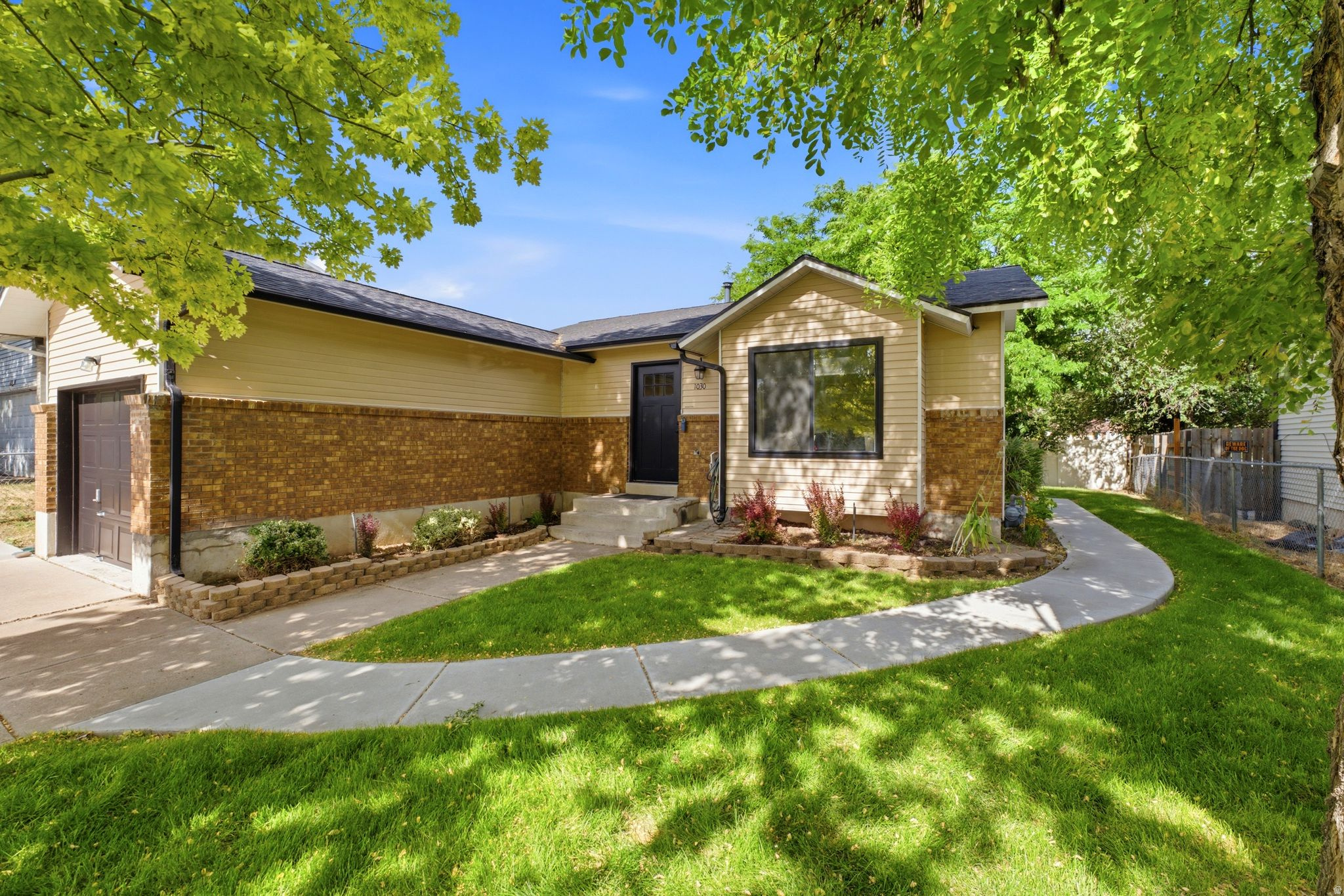 Beautifully remodeled and move-in ready, this thoughtfully updated home offers modern finishes, low-maintenance ownership, and exceptional flexibility. Nearly every major component was renovated in 2021, including a new roof, central air, water heater, gutters, windows, luxury vinyl plank flooring, updated kitchens and bathrooms, granite and quartz countertops, lighting, interior paint, landscaping, RV parking, and more. Filled with natural light, the open-concept main level features vaulted ceilings, a spacious living area, an updated eat-in kitchen, designer finishes, and a primary suite with a walk-in closet. The bright daylight walk-out basement offers a remodeled second living space complete with its own kitchen and laundry, making it ideal for multigenerational living, extended guests, or other permitted uses. The property also has a proven history of strong rental income, offering excellent flexibility for buyers seeking supplemental income. Outside, enjoy mature shade trees, fresh landscaping, a private backyard backing to open space with no rear neighbors, a patio with mountain views, a storage shed, an insulated one-car garage, three additional off-street parking spaces, and RV parking. With no HOA and a location just minutes from Hill Air Force Base, freeway access, shopping, dining, parks, and everyday amenities, this turnkey property is an exceptional opportunity for homeowners and investors alike. Take a look at this one today!