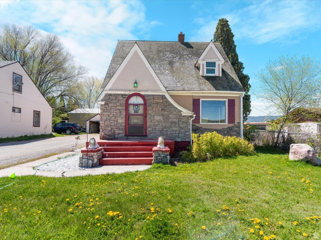 This beautifully updated home is truly one to remember and is currently operating as a successful Airbnb/bed and breakfast, though it is being sold strictly as a home. From the moment you arrive, the home's unique architectural style, steep roof lines, stone vestibule, fresh stucco, updated windows, shutters, and paint create unforgettable curb appeal. Inside, the home feels warm and welcoming with updated stair bannisters, a remodeled kitchen featuring a cozy breakfast nook, updated bathrooms, and 3 spacious bedrooms. This property is move-in ready and filled with charm and character throughout. Outside, the large deep lot offers even more to appreciate and also features a unique bomb shelter, chicken coop, and a brand new shed already in place. The shed has been sheet rocked with partial electrical completed and offers great potential for additional space, storage, a studio, workshop, or hobby area.  Whether you're looking for a full-time residence, second home, or getaway property, this home offers a rare combination of style, comfort, and opportunity. Call the listing agent for details!